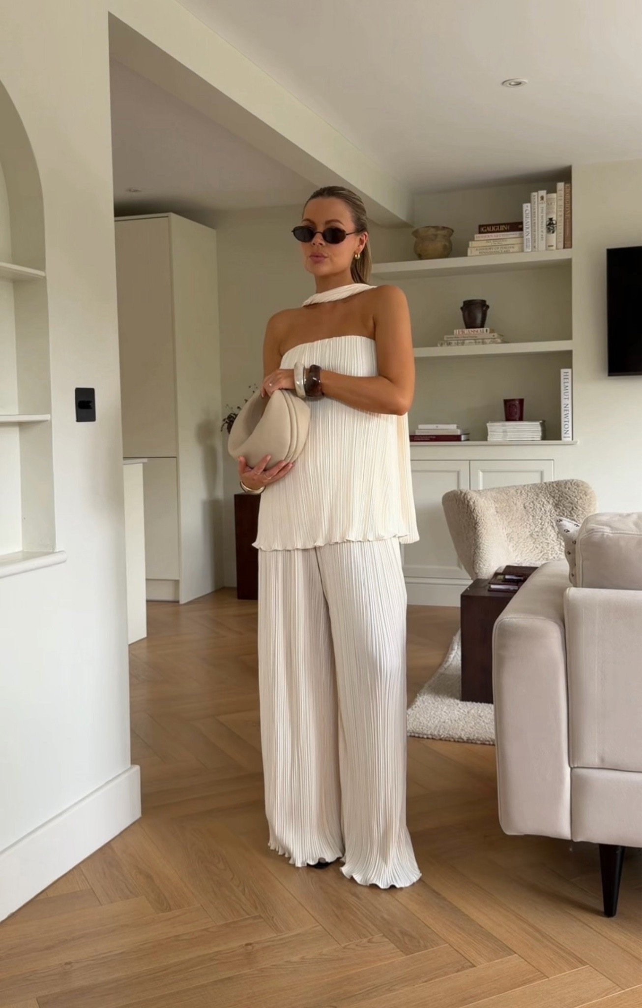 4th & Reckless cream pleated co-ord set, ivory two-piece set, pleated halter top, scarf neckline detail, bandeau-inspired silhouette, sleeveless top, flowing pleated fabric, relaxed fit, wide-leg pleated trousers, matching co-ord set, monochrome dressing, neutral tones, elegant resort wear, minimalist fashion, effortless sophistication, quiet luxury aesthetic, old money style, European summer outfit, coastal chic, luxury-inspired fashion, elevated basics, contemporary tailoring, soft drape silhouette, lightweight occasion wear, vacation outfit, holiday wardrobe, chic event styling, modern elegance, timeless wardrobe staple, refined feminine style, understated glamour, capsule wardrobe essential, relaxed luxury, sophisticated day-to-night look, minimalist chic, polished resort aesthetic

#LTKspring #LTKsummer #LTKuk
