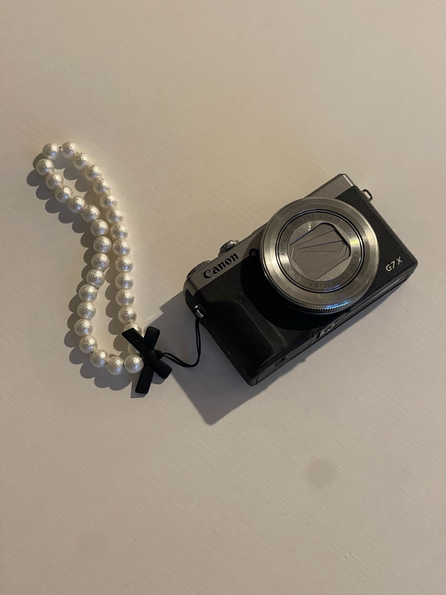 My secret weapon 📸📸 I use the Cannon g7x mark iii & I highly recommend it! + this pearl wrist strap from amazon make is it so cute 🤍

Camera inspo - digital camera - cannon cameras - camera wrist strap inspo - pearl camera strap - amazon finds - amazon must haves 

#LTKstyletip