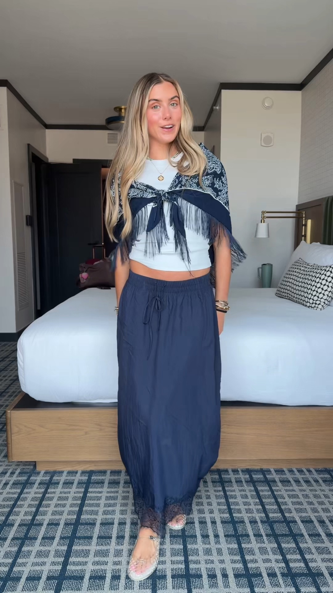 My LTKCON travel outfit from TPA to DALLAS! I’m wearing my Cuts Clothing tomboy tee size xs (code SLOANEV) the best baby tees. My skirt is amazon Tanming Women's Drawstring High Waist Lace Hem Midi Skirt Elastic High Rise, Delicate Lace Trim, Flattering A-line Fit, Side Pockets, Soft Flowy Fabric, Summer Casual Beach Wear size small. My fringe scarf is a WALMART find! How fun I grabbed both colors. My shoes are clear ballet flats from Tory Burch. 

Jewelry: earrings are @electricpicks Bentley earrings layered with my ring concierge duster earrings. My necklace trio is @electricpicks   jewel necklace the one that looks like a tennis necklace and bauble bar turquoise tennis necklace. The pendant is @janewin

#LTKCon #LTKootd #LTKTravel
