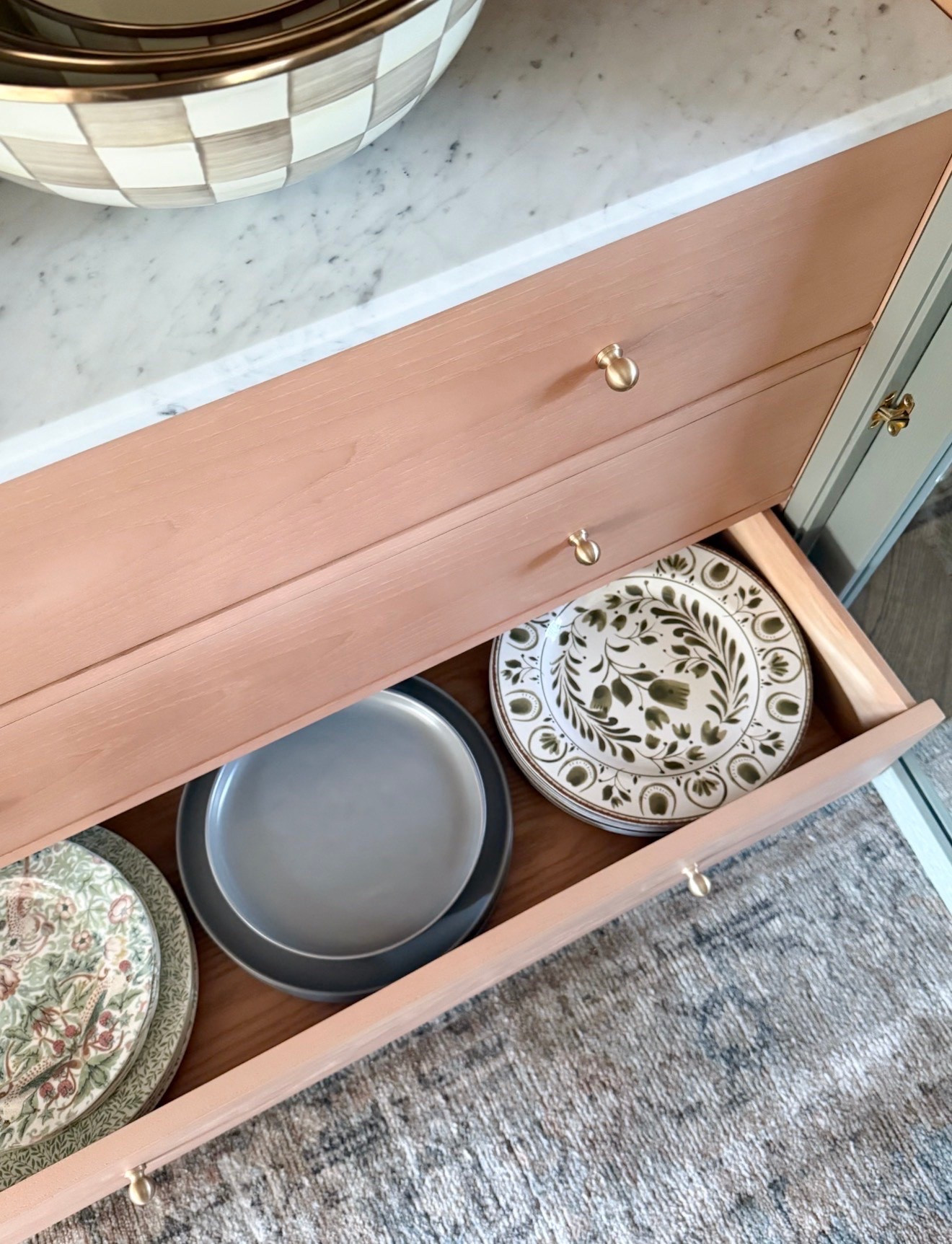This cabinet is such a fun way to bring color into a room while still keeping the piece timeless. The soft blush finish, marble top, and brass hardware work so well together, and I love how the drawers can be used to tuck away dishes while still making them easy to access for entertaining.

painted cabinet decor, blush furniture, dining room storage, brass hardware furniture, marble top cabinet, dish storage ideas, traditional home decor, colorful furniture inspiration, dining room organization, collected interiors, statement furniture girlonthehudson

#LTKHome #LTKfoodie #LTKmomlife