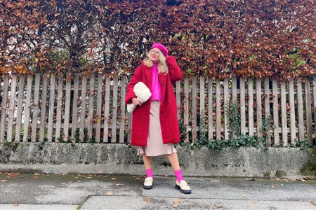 Pink Red Festive Look. Fashion Blogger Girl by Style Blog Heartfelt Hunt. Girl with blond hair wearing a pink beanie, red teddy coat, pink sweater, satin skirt, faux fur bag, pink socks and chunky loafers. #colorfuloutfit #colorfulstyle #colorfulfashion #colorfullooks #fashionfun #cutefalloutfit #fallfashion2022 #falllookbook #fitcheck #dailylooks #dailylookbook #contentcreator #microinfluencer #discoverunder20k