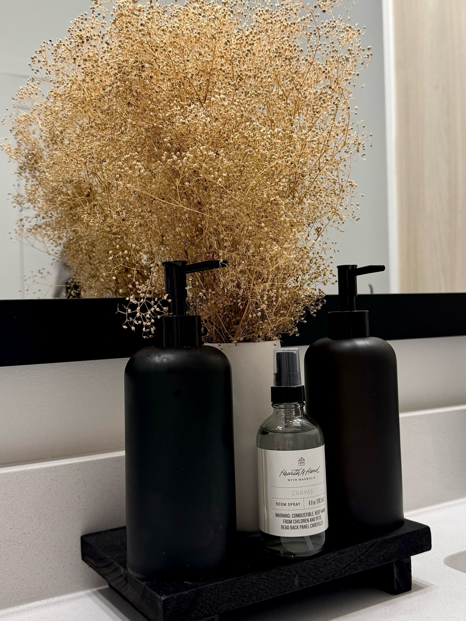Neutrals in the bathroom🤍 
Plant is from HomeGoods! 
#apartmentdecor #bathroomdecor 