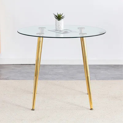 Round Dining Table With Glass Top, Gilded Metal Legs, Exquisite Living, Starting From The Details, The Legs Show An Extraordinary Texture, Which Is Th | Wayfair North America