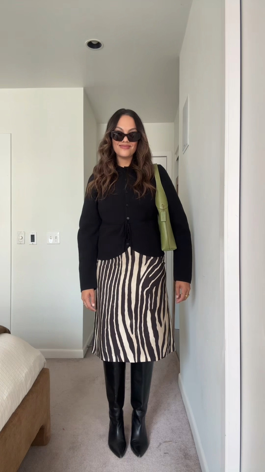 Fall outfit idea!

-Dissh black cinched cardigan, I have a medium. @DISSH 
-Massimo Dutti zebra print skirt, I have a size 40. Similar options linked. 
-Poppy Barley black leather knee-high pointed boots. I have calf width three. 
-Coach Brooklyn bag. Similar colour linked. ￼

#LTKfall #LTKstyletip #LTKcanada
