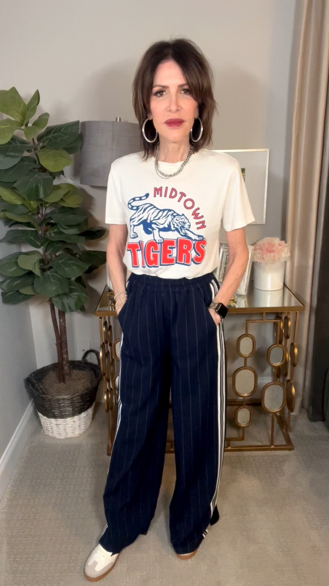 silver hoop earrings, tiger graphic tee, striped track pants, neutral sneakers, casual outfit, over 50 outfits 

#LTKSeasonal #LTKOver40 #LTKootd