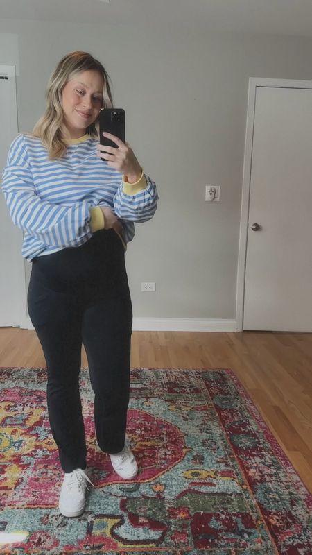 Comfy pregnancy outfit / sweatshirt is free people inspired, flare leggings and white sneakers, gold necklace, gold earrings #amazonfinds #maternity 

#LTKbump #LTKshoecrush #LTKfindsunder50