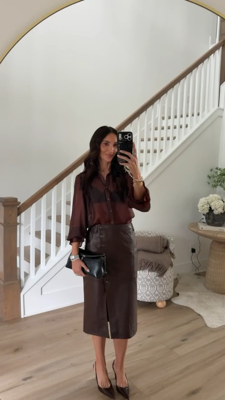 Date night calls for a little chocolate brown. 🤎 I love the satin blouse paired with this leather midi skirt and pointed heels. The mix of textures makes the whole outfit feel so sophisticated for a fall evening out.
date night outfit, chocolate brown outfit, satin blouse, leather midi skirt, brown leather skirt, fall date night, dinner outfit, monochromatic outfit, fall fashion, dressy fall outfit, women over 40 style, annabrstyle