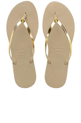 Havaianas You Metallic Flip Flop in Sand Grey & Light Golden from Revolve.com | Revolve Clothing (Global)