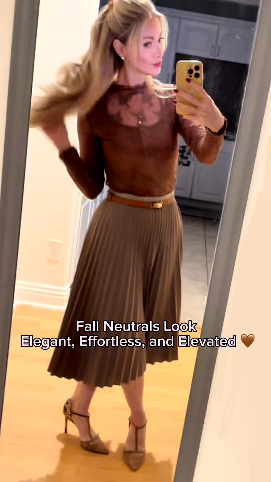 Soft tones, timeless textures 🤎✨ This neutral fall outfit is all about classic layering and effortless chic. I paired a taupe pleated midi skirt with a sheer lace top, cinched with a thin camel belt and topped with a cozy knit cardigan for a pulled-together finish. Gold accents like the Gorjana Shorebreak Necklace and PAVOI eternity ring add just the right touch of warmth and shine — perfect for brunch, date night, or a crisp fall stroll. 🍁

#FallStyle #NeutralOutfit #FallFashion #OOTD #ClassicStyle #ChicNeutrals #LTKFallFashion #LTKOutfitInspo #ElegantStyle

#LTKStyleTip #LTKSeasonal #LTKFindsUnder100