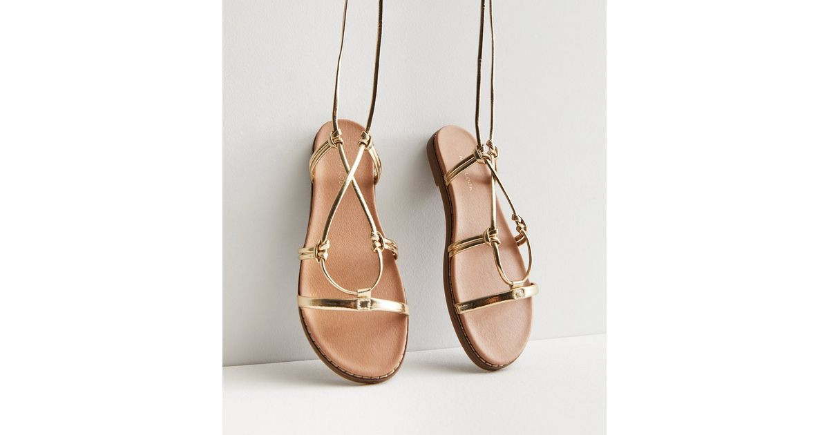 Gold Tie Strap Footbed Sandals
						
						Add to Saved Items
						Remove from Saved Items | New Look (UK)