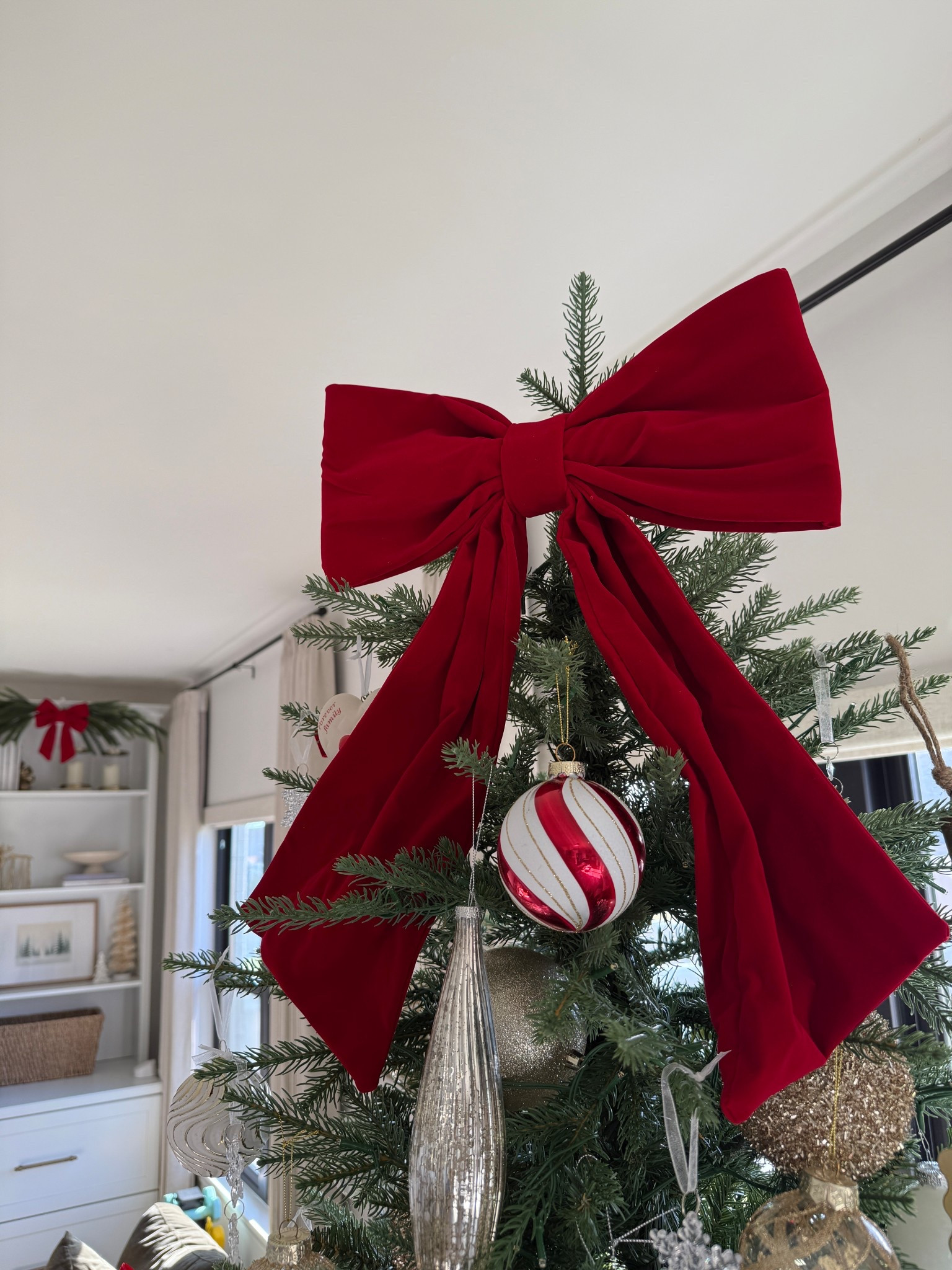 The prettiest red bow tree topper from Target! 

#LTKHoliday #LTKHome