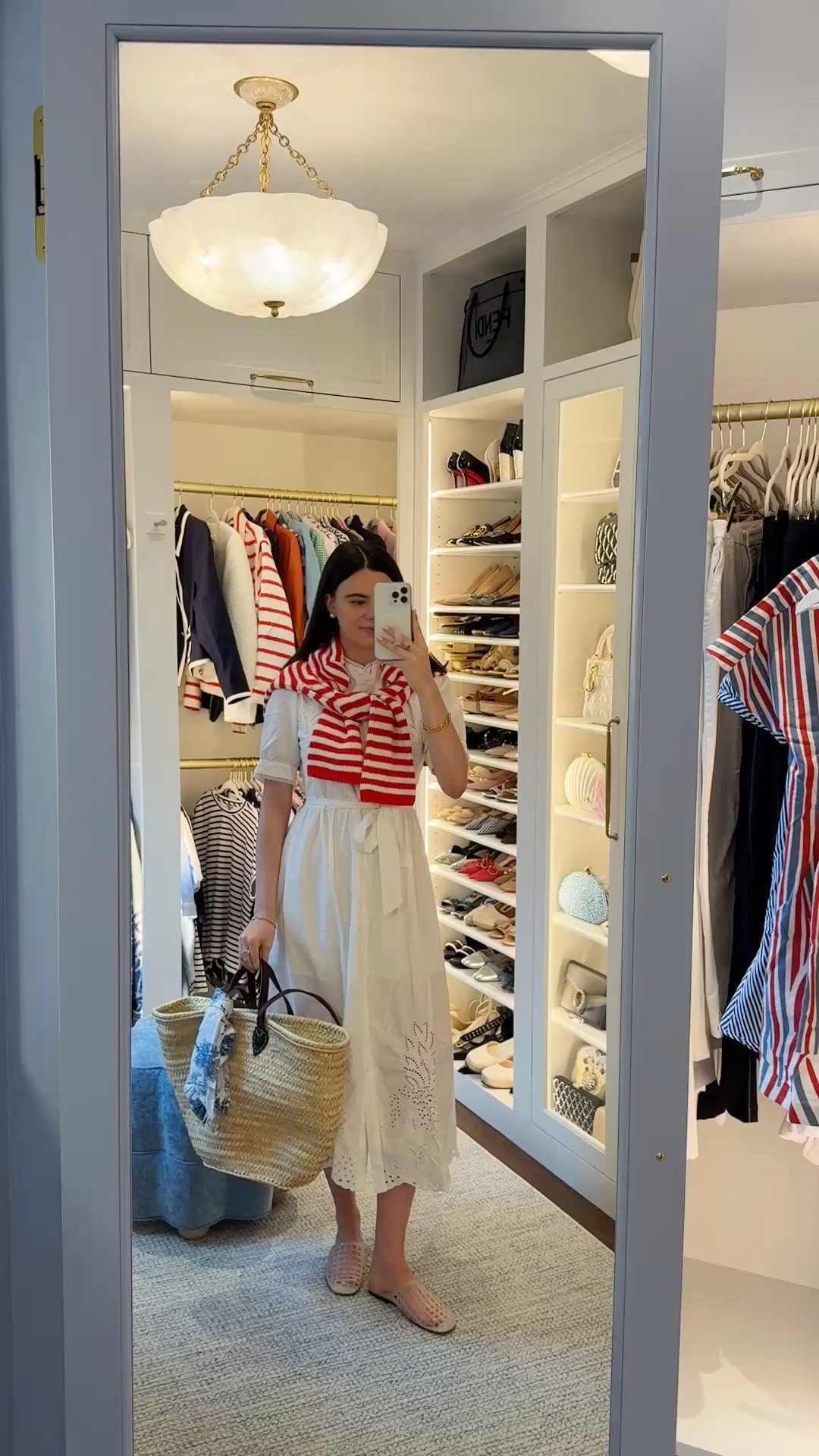 Amazing Amazon find! This white shirt dress is so pretty on and I paired it with a red and white striped sweater from Target! Tote is emilyOandbows 🎀