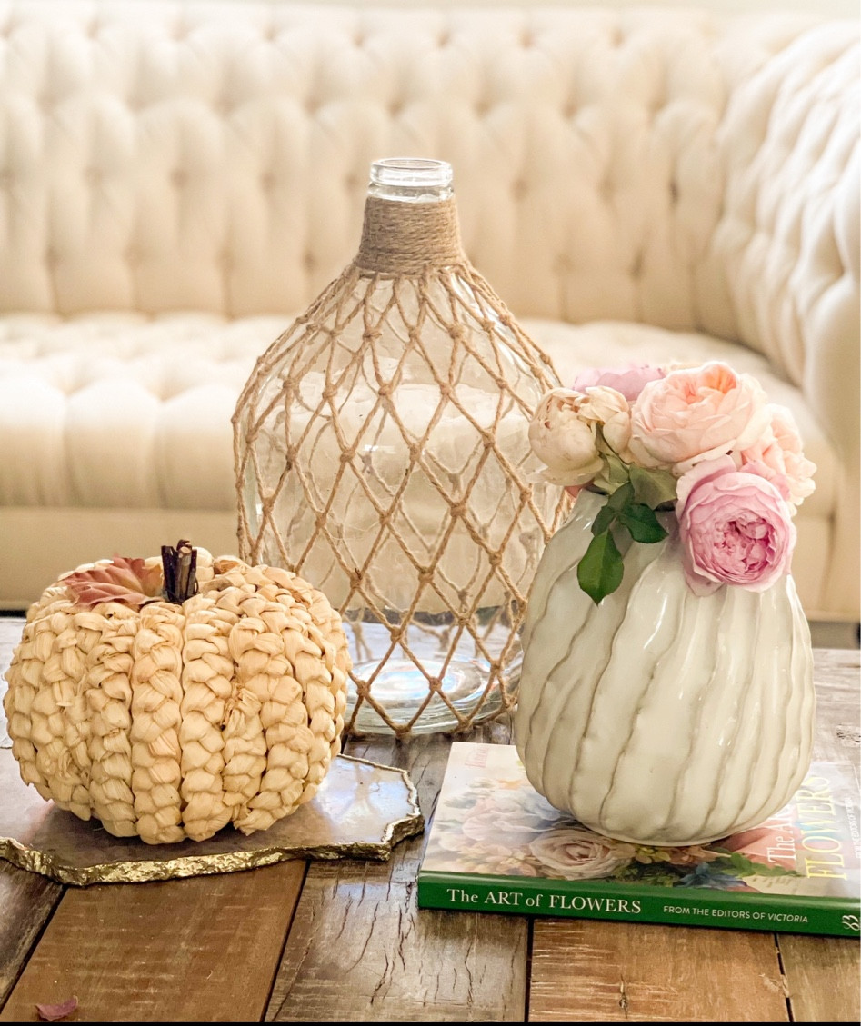 Woven pumpkin. Halloween decor. Rattan pumpkin. White ceramic vase. Rustic coffee table. Floral book. Trending fall decor. 

#LTKSeasonal #LTKhome #LTKHalloween