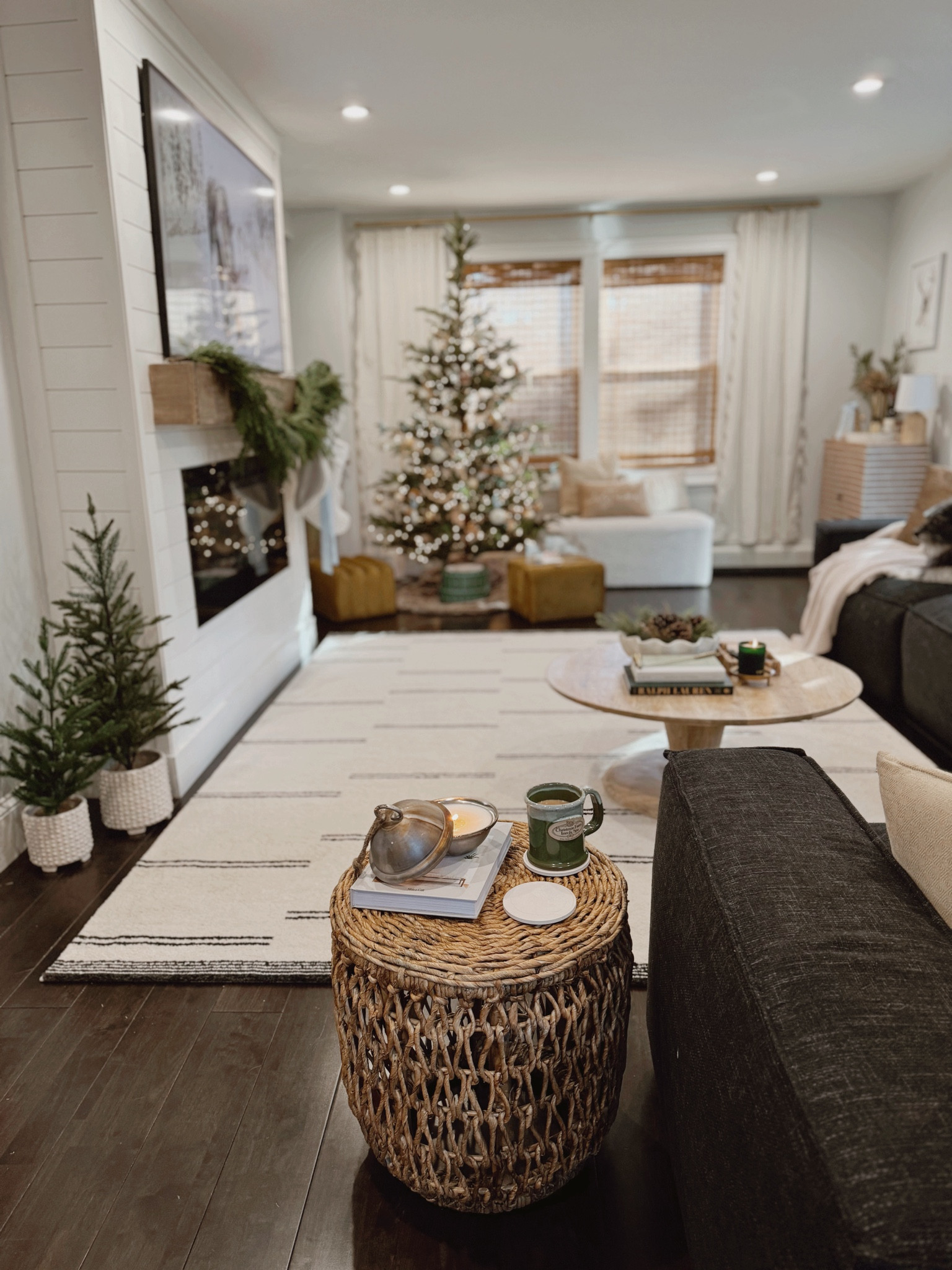 Our family room is holiday hosting ready thanks to @mycurahome ✨🎄 

This stunning arched boucle bench and ottoman set add the perfect amount of style and seating functionality around our tree. We are looking forward to making so many memories for Leighton’s first Christmas and saving them all in this gorgeous gold mirrored acrylic box for years to come. Im obsessed with the hobnail planter set and how it added the perfect base to our festive mini trees adorning the fireplace. The woven side table is adding the perfect amount of modern coastal flare to our holiday season 🌊 

Check out all of their beautiful pieces using the link in my bio and receive 10% off your first purchase🫶🏼

#ltkhome #shopltk #mycurahome #curahome #coastalstyle #moderncoastal #holidaylivingroom #neutralchristmas #blackandwhitelivingroom #ad #gifted 

#LTKSeasonal #LTKHoliday