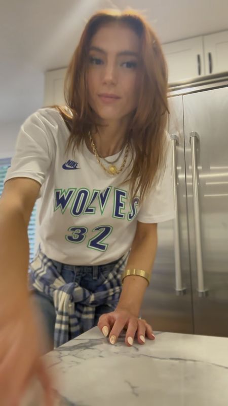 Timberwolves look 
Layered with a plaid button up flannel 
Gold retro watch 
Gold chain necklaces 

#LTKStyleTip #LTKFindsUnder100 #LTKFitness