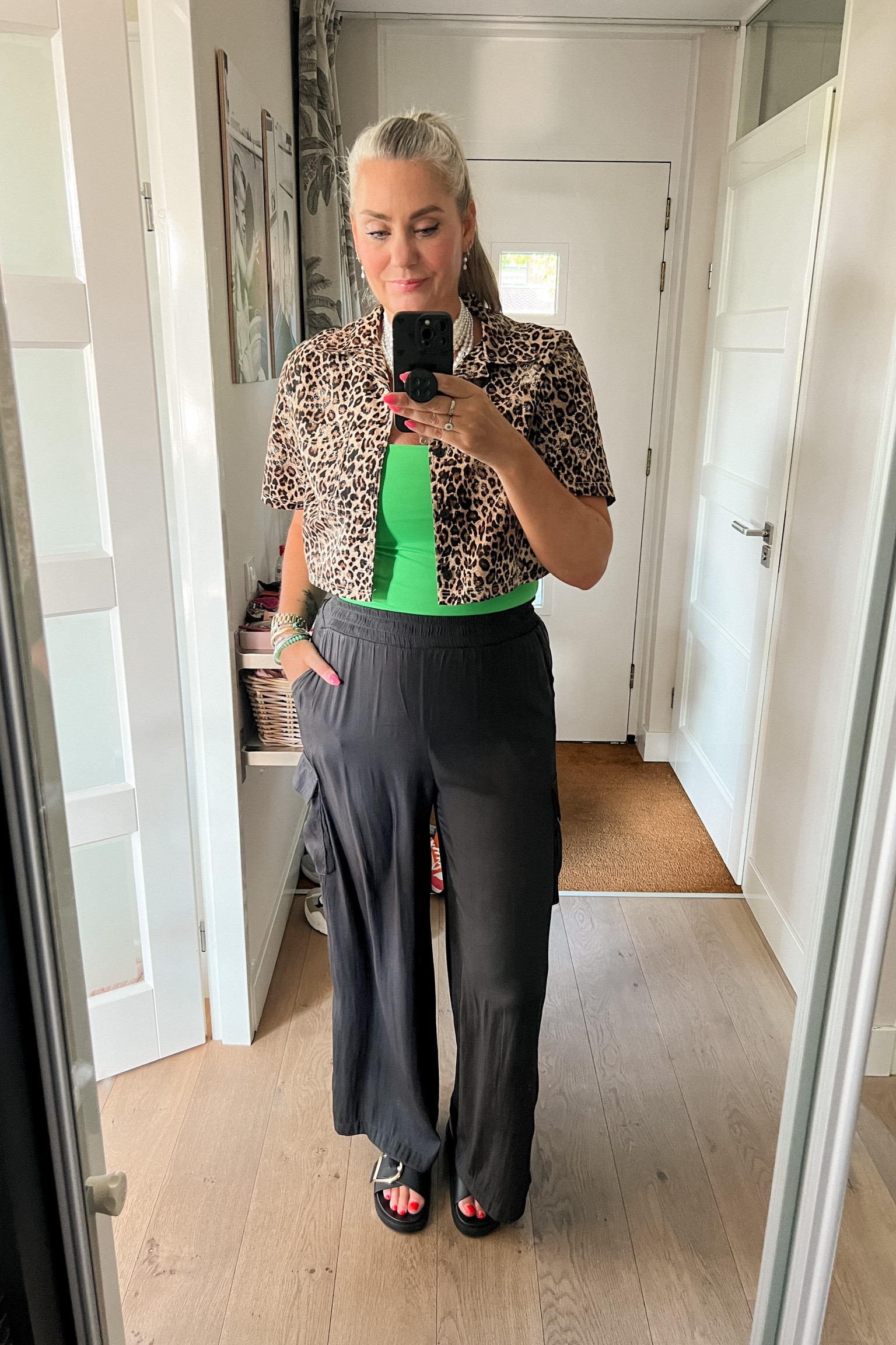 Ootd - Wednesday. Bright green tanktop (Zara) paired with a cropped leopard shirt that I wear as a jacket and black matte satin trousers (old Bristol) and H&M black sandals with a big gold buckle. Multi layered pearl necklace. 

 

#LTKstyletip #LTKnederlands #LTKeurope