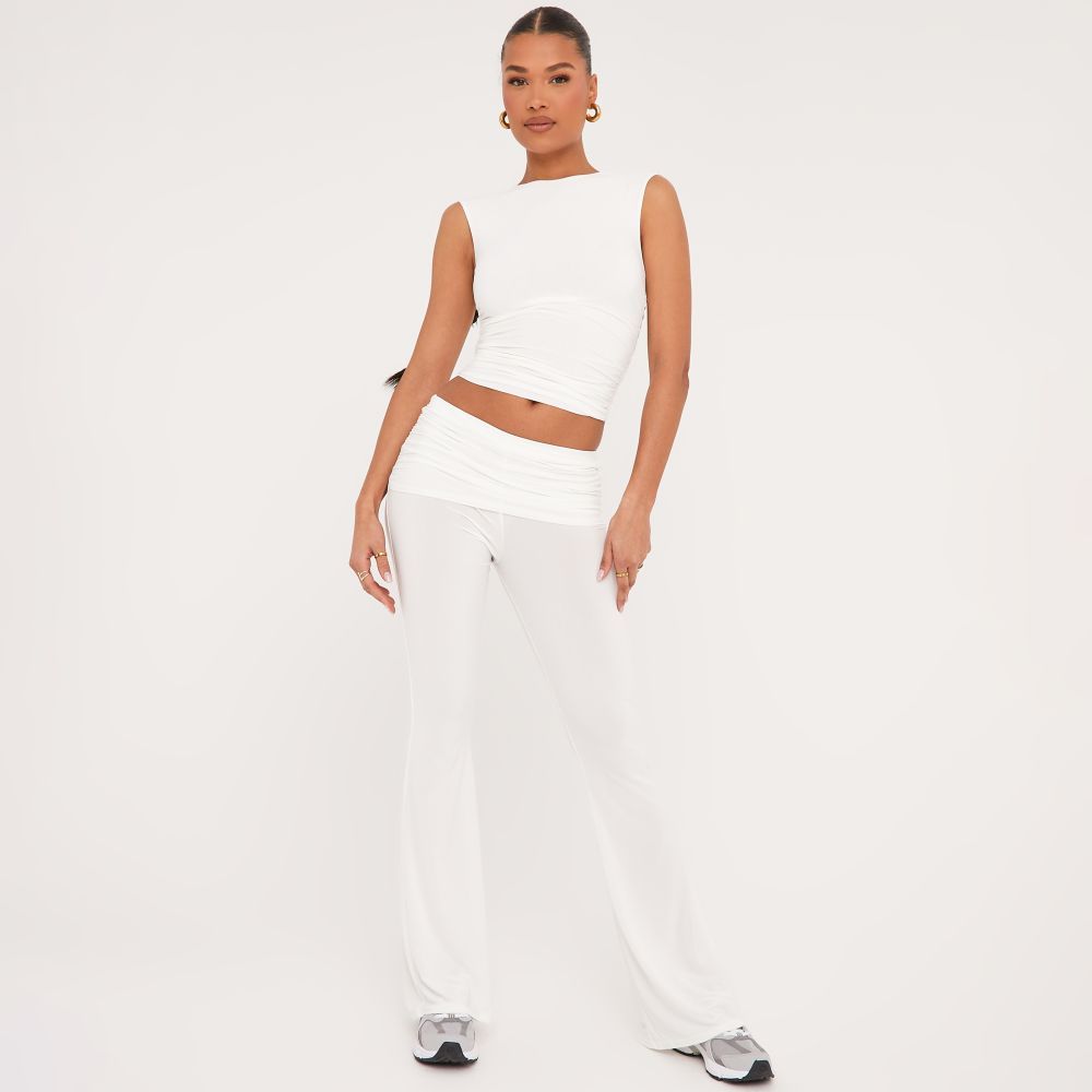 High Neck Sleeveless Top And Low Rise Fold Over Flared Trousers Co-Ord Set In White Slinky | EGO Shoes (US & Canada)
