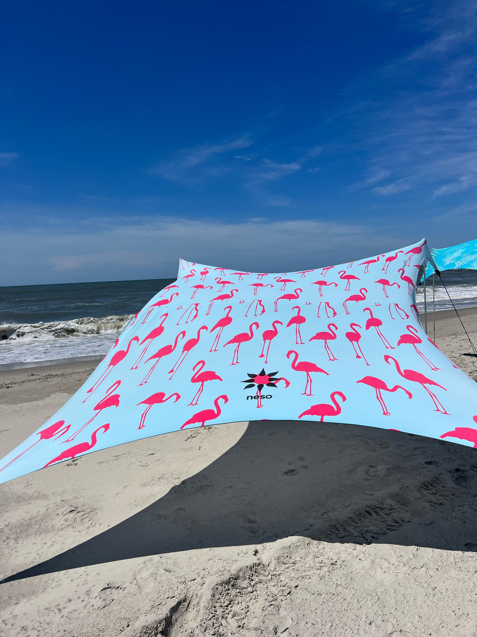 Neso beach tent - lightweight and no wind required 

#LTKSeasonal #LTKtravel #LTKswim