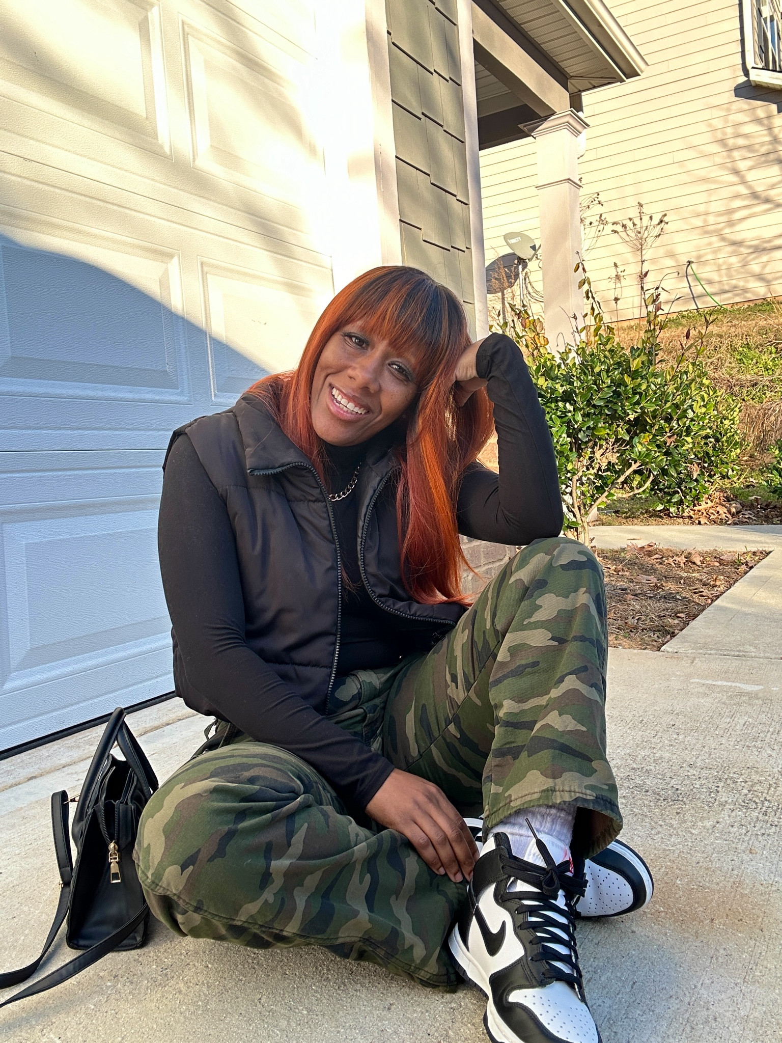 Camo outfit idea. I’m wearing camo cargo pants with a black shirt, black puffer vest, black purse, and panda dunk high.

#LTKShoeCrush #LTKStyleTip #LTKSeasonal