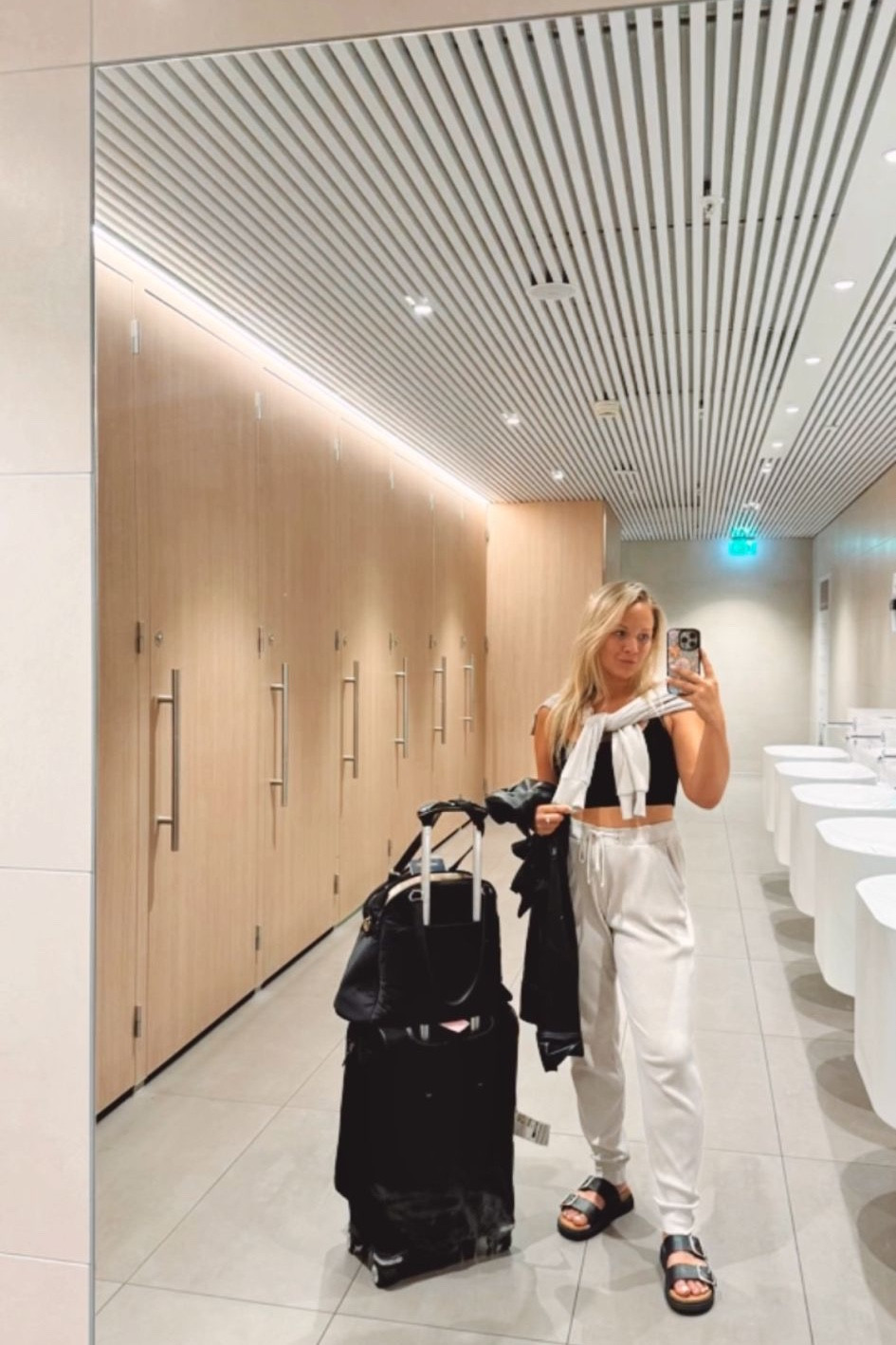 Travel OOTD forever 🙌🏼 Being comfy but cute makes me feel good on the go — loving these pieces to feel fresh yet relaxed while on a long flight. 

My weekender bag is currently 30% off right now, under $270. Lightweight with space for your laptop, separate shoe compartment and plenty of pockets. Has leather accents and water resistant zippers! 8 color options. 

My set is my go-to favorite! And these shoes are the BEST. #LTKItBag 

#LTKSaleAlert #LTKTravel