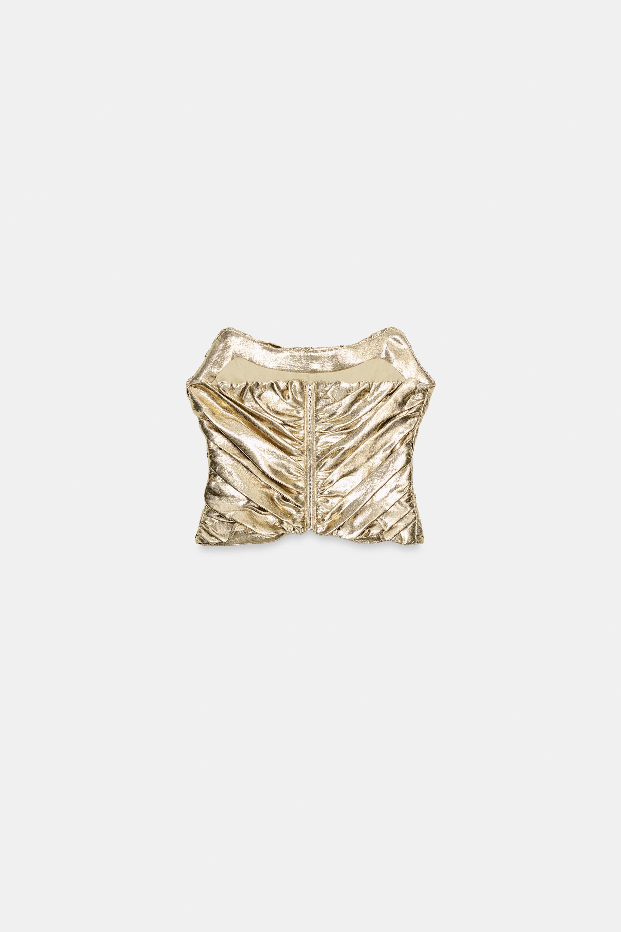 Round neckline, off-the-shoulder top. Pleated detailing. Matching interior lining. Asymmetric hem... | Zara US