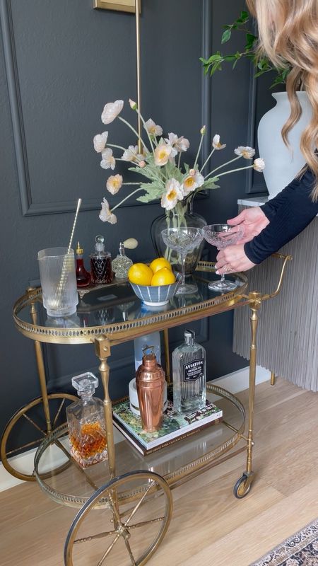 Bar cart styling to kick off the weekend! So many of these are Amazon finds! My bar cart is vintage, but linked similar styles 🍸

crystal coupe glasses, fluted barware, decanter, bowl, vase, faux stems, entertaining 

#LTKunder50 #LTKstyletip #LTKhome