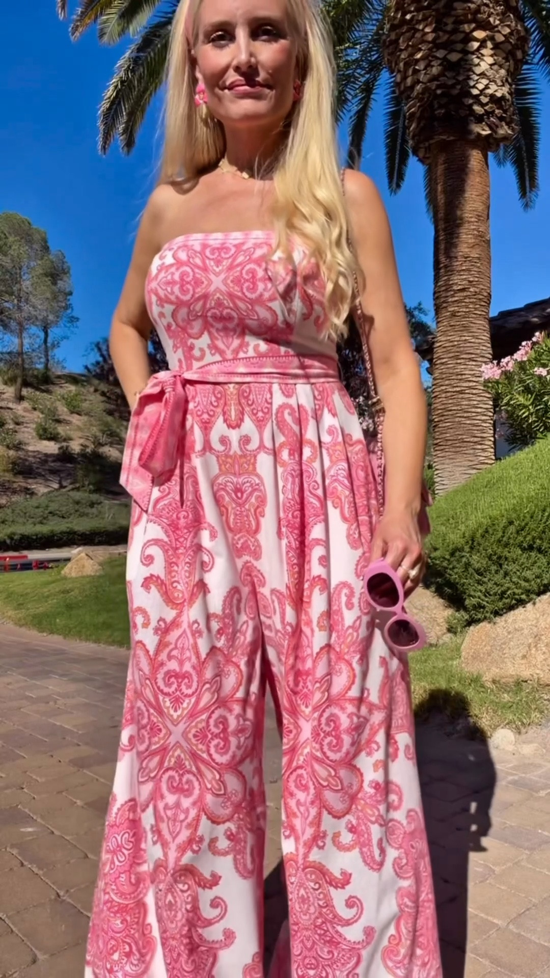 The jumpsuit I will be wearing on repeat all spring & summer 🌸🌷💕 I love the breezy linen fabric, tailored fit & fabulous pink paisley design 🤩 I wore this for ladies poker night and paired it with a pink handbag, pink floral earrings & rattan platform sandals, and tied a pink satin sash as a headband 👛🎀💕 This jumpsuit sold out once and is back in stock right now but not for long!! Runs tts, I'm wearing a size small. 🌸🌸 Use code LOVINGLIFE35 for 35% off! 😘💕

#summerstyle #vacationstyle #pinkstyle #linenjumpsuit #summerfashion @vici 

#LTKdayinmylife #LTKgrwm #LTKootd