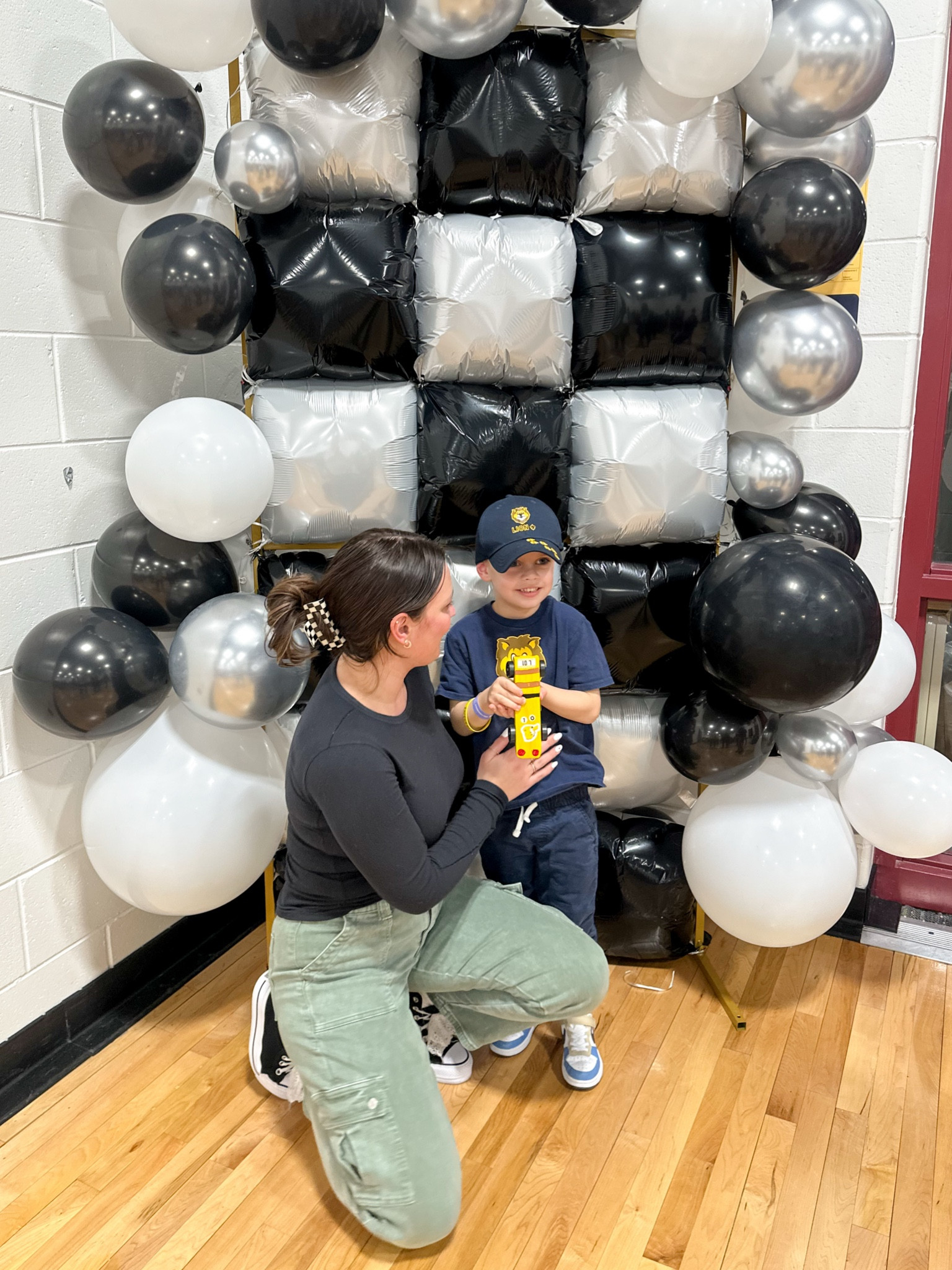 Proud mom moment with my biggest dude 🫶🏽🏁