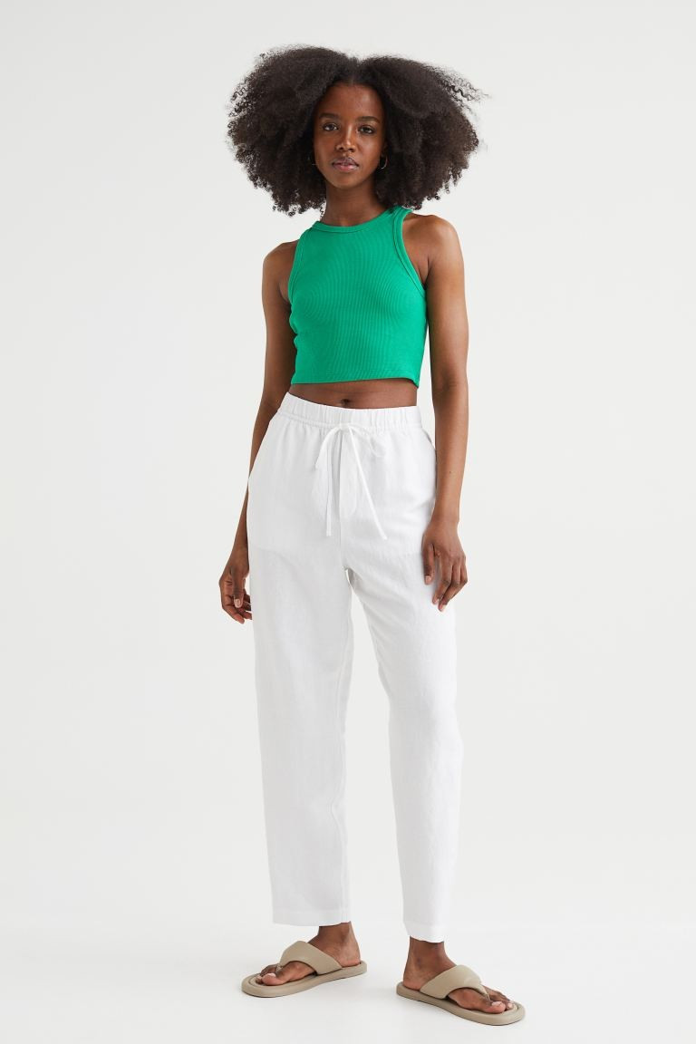 Tkaninowe spodnie z mieszanki lnu i wiskozy z wysokim stanem. Elastyczna talia ze sznurkiem, uko... | H&M (DE, AT, CH, NL, FI)