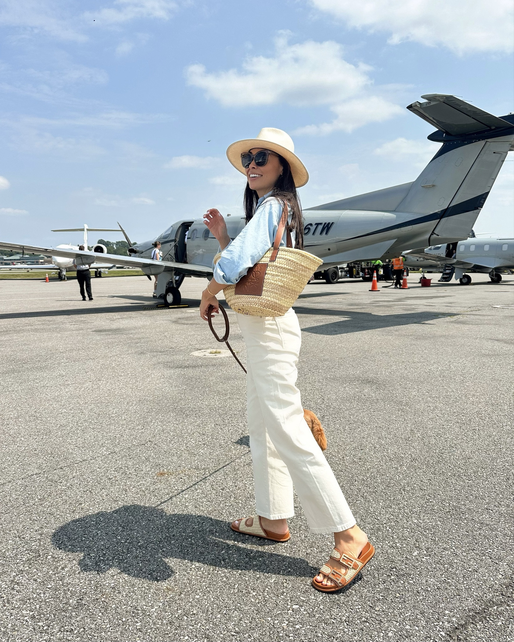 Best jeans! True to size. Vacation outfit, travel style, Kat Jamieson style, Tradewind flight to Nantucket, Fendi sandals, Loewe straw tote. 

#LTKautumn #LTKTravel #LTKSeasonal