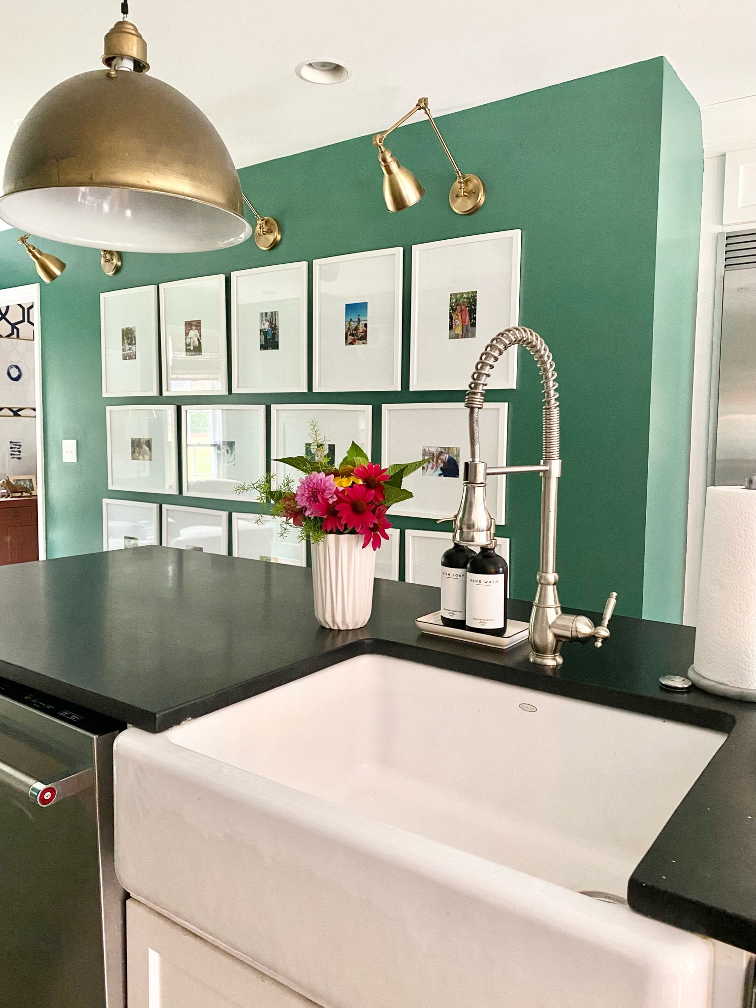 Kitchen gallery wall, brass pendant, fluted white vase, soap dispenser, library sconce lights 

#LTKFind #LTKhome