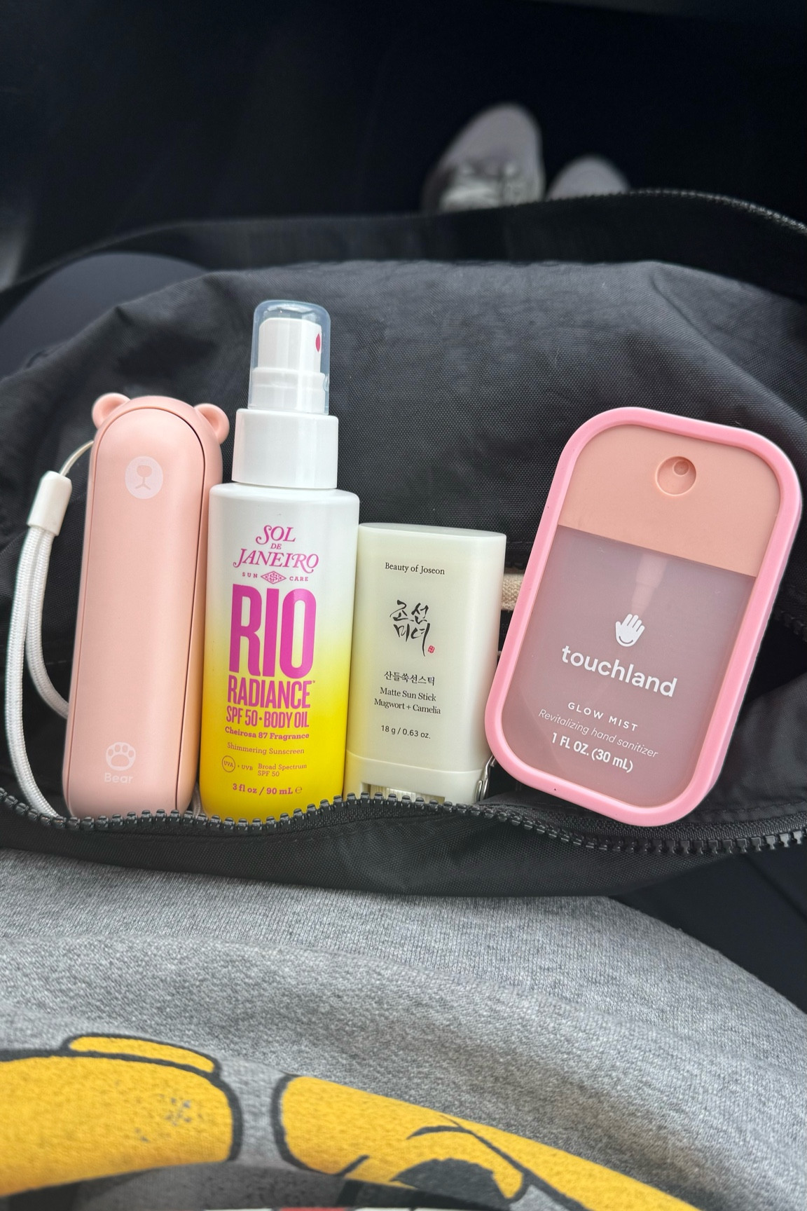 Fair essentials: Handheld fan, Sol de Janeiro shimmering body oil spf 50, Beauty of Joseon sunscreen stick, Touchland hand sanitizer spray.

#LTKBeauty