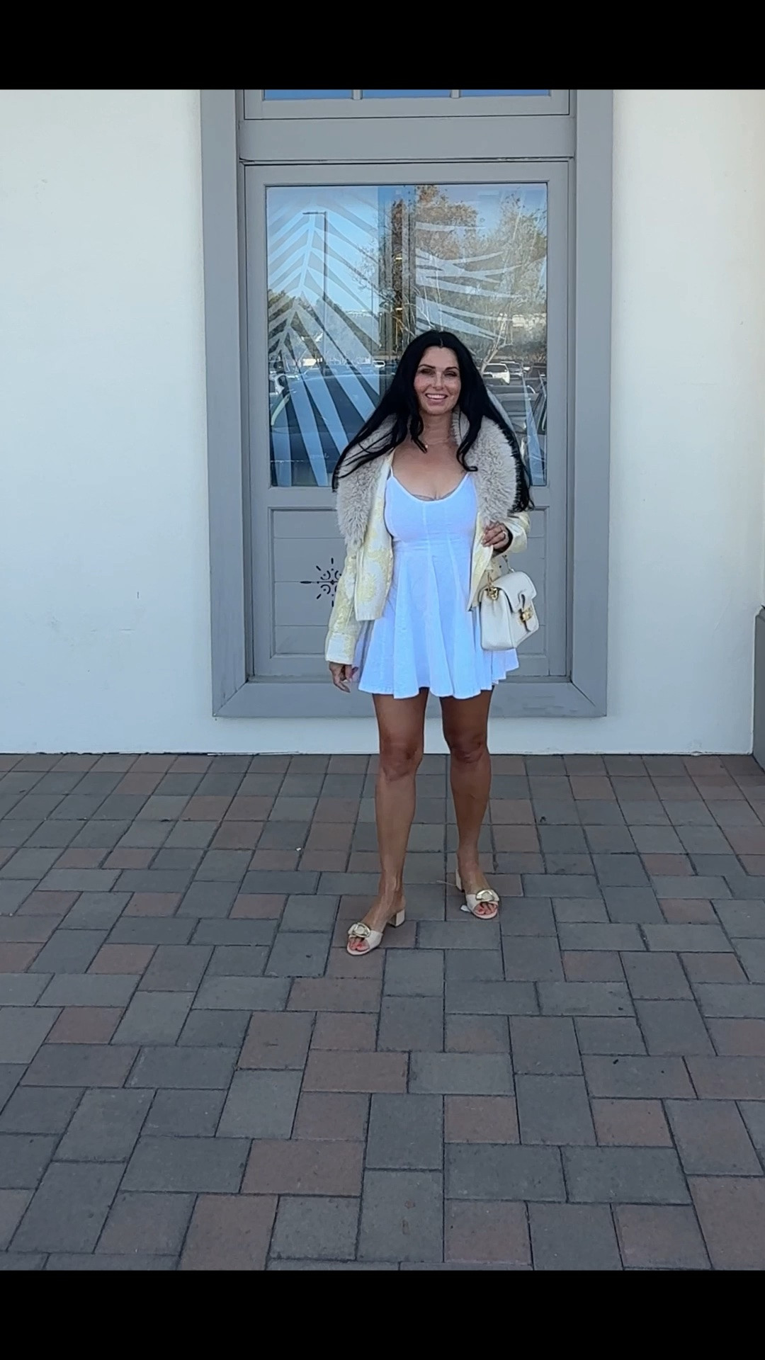 Summer Outfits 2026!🤍

This cute white @freepeople mini dress is perfect for a sunny brunch or a fun vacay!

It's very comfortable and the material is stretchy. It runs true to size. I paired it with tan heels, a white purse, and a cropped jacket with faux fur. 🌼

#vacationoutfitsbeach #minidress
#summerdresses #whitedress #tanslides