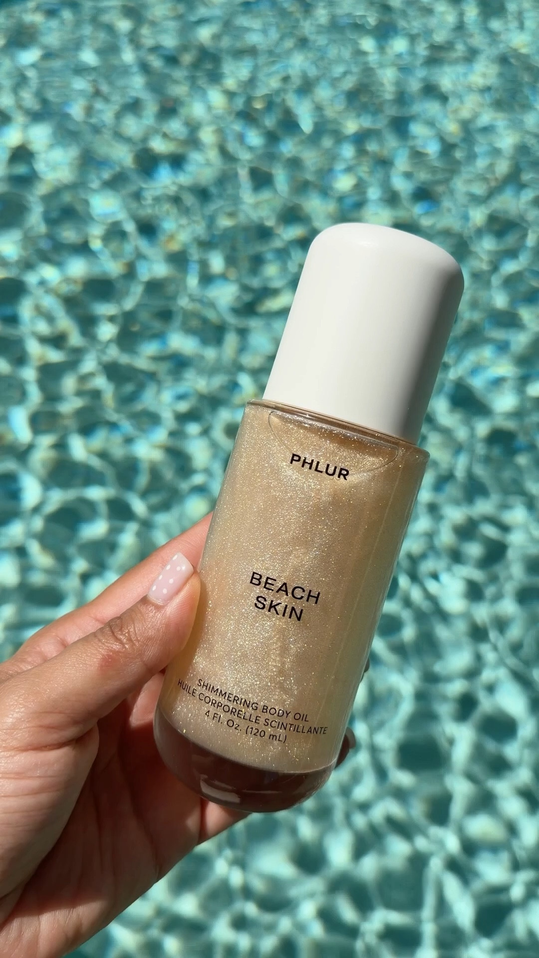 What if i told you it smells better than it looks ✨ 🐚 it literally smell like a beach day - sandalwood, bergamot, vanilla & coconut with the most stunning glow you can add after the shower or over your SPF 🤍

@PHLUR #phlur #beachday #summerscent #bodyoil #bodyshimmer #coconut #beachessentials #summeressentials 

#LTKSwim #LTKSeasonal #LTKBeauty