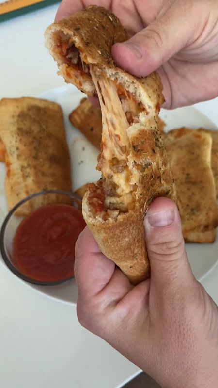 Homemade Pizza Pockets! This is an easy weeknight dinner that my kids (and hubby) love. *I’ve linked all kitchen items used

What you need:
One tube of pizza crust
pizza or pasta sauce
cooked ground sausage (or topping of your choice)
shredded mozzarella cheese
olive oil
dried oregano
extra pizza sauce for dipping (optional)

How you make it:
Preheat your oven to 425 degrees. 
Cut the pizza crust into 6 squares using a pizza cutter. I just bought this new one and I LOVE it. 
Spoon some pizza or pasta sauce onto the center of each square. 
Top with some cooked ground sausage (or pepperoni, veggies, no meat, you choose!)
Sprinkle mozzarella cheese on top of the toppings. 
Fold over each square and using a fork, press the edges closed. 
Place the pizza pockets onto a greased or nonstick baking sheet.
Using a brush, brush olive oil over the top of each pocket and then sprinkle dried oregano over top. 
Bake at 425 degrees for about 10-15 minutes, until golden brown on top. 
Serve with some dipping sauce on the side!


#LTKhome #LTKfamily #LTKunder50