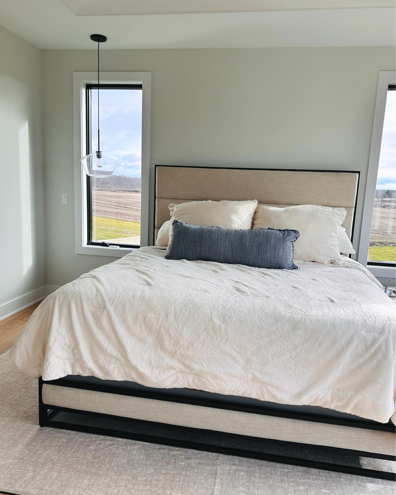 Our master bedroom is almost complete, we are just waiting on our night stands! All of our bedding is from target. The bed frame is from Crate and Barrel and the lights are from West Elm. Our bed itself is a sleep number which I highly recommend! 

#LTKhome