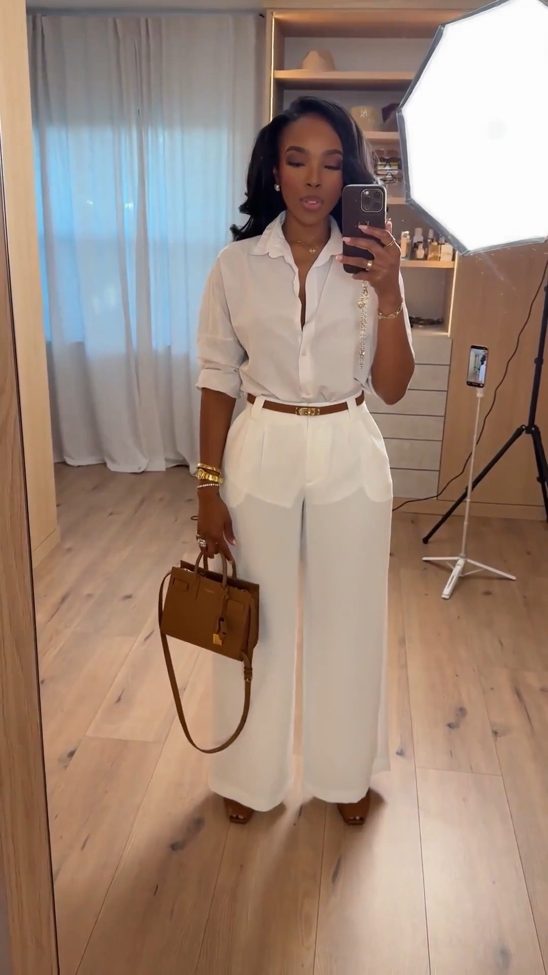 Hi babes! 🤍

An all-white look will always feel classy, timeless, and elevated. I love how tailored yet effortless this outfit feels — the flowy trousers, crisp button-down, and brown accessories make it look so expensive without doing too much.

Perfect for:
Work outfits
Dinner dates
Vacation dinners
Brunch plans
Summer events
Elevated everyday styling

📏 Measurements: 5’4”, 140 lbs, 36D bust, 27” waist, 40” hips  
Wearing a size Small | Pants 27 Long

Everything is linked below ✨

xx Kira | IG: KirasFashionFinds

#LTKWorkwear #LTKStyleTip #LTKFashion