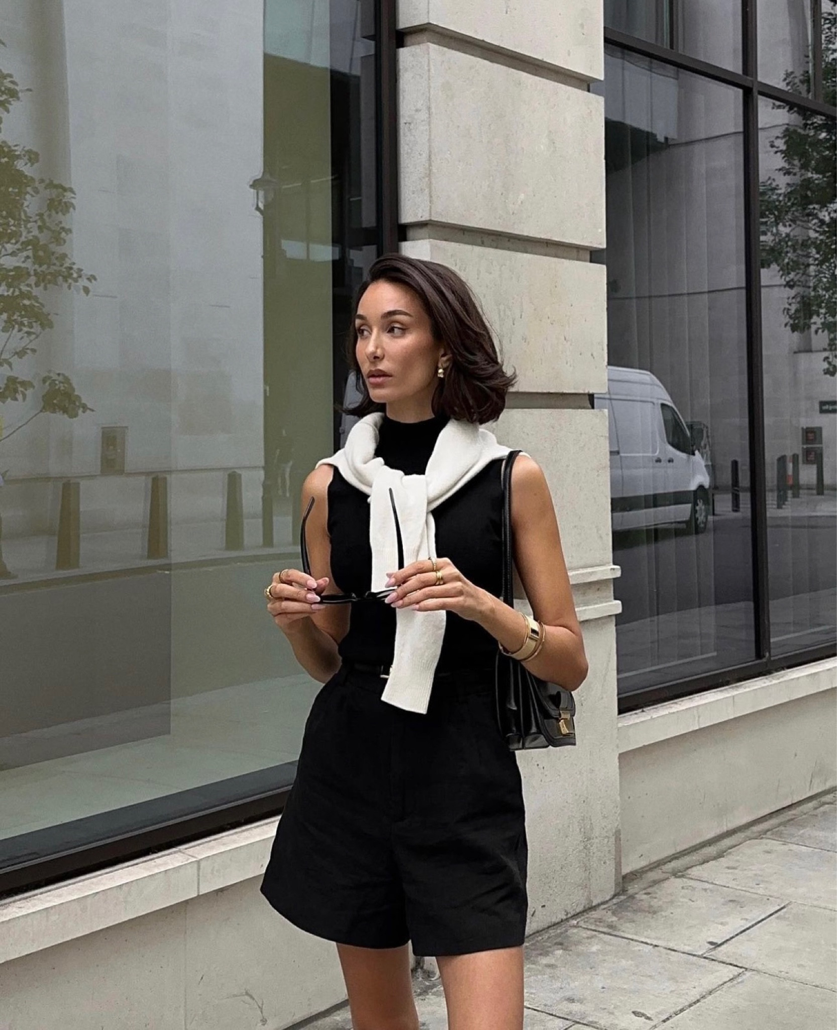 Monochrome outfit, autumnal styling, transitional outfit, tailored shorts, Forever New clothing, black shorts, sleeveless high neck black top, all black outfit, ASOS, H&M, black sunglasses, black bag, white jumper, street style, autumn fashion  

#LTKeurope #LTKstyletip #LTKSeasonal