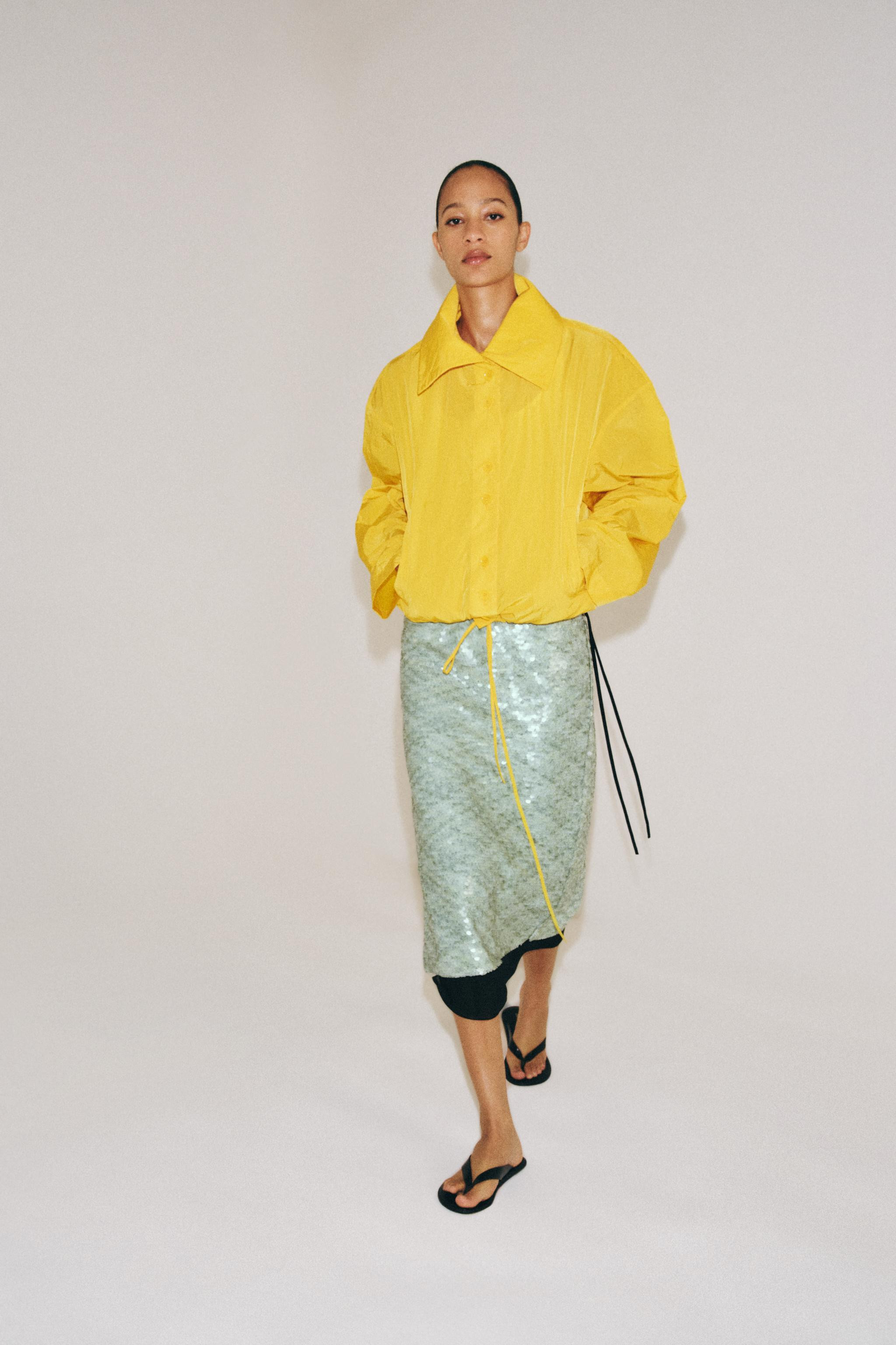 ZARA WOMAN COLLECTION. Jacket with a high collar and long sleeves. Side pockets hidden in the sea... | Zara US