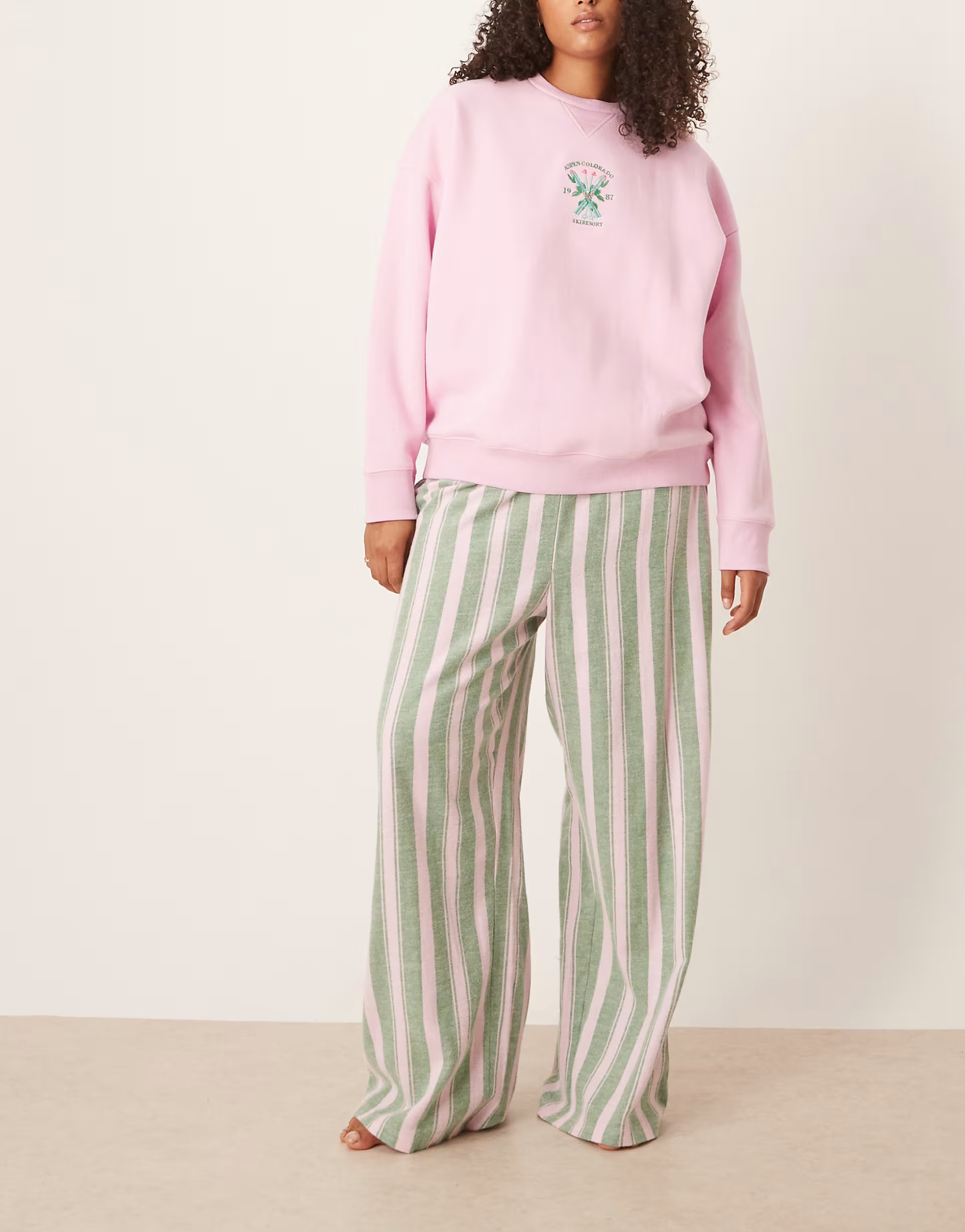 ASOS DESIGN Curve logo jersey sweatshirt pajama set with woven pants in pink and green stripe | A... | ASOS (Global)