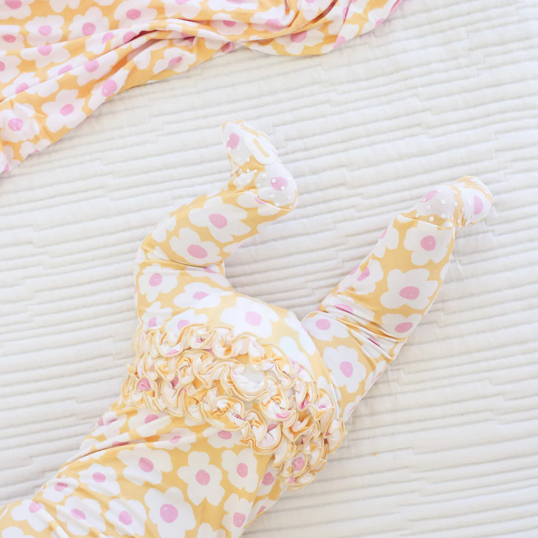 Sunshine Daisy Ruffle Zipper Footie | Caden Lane