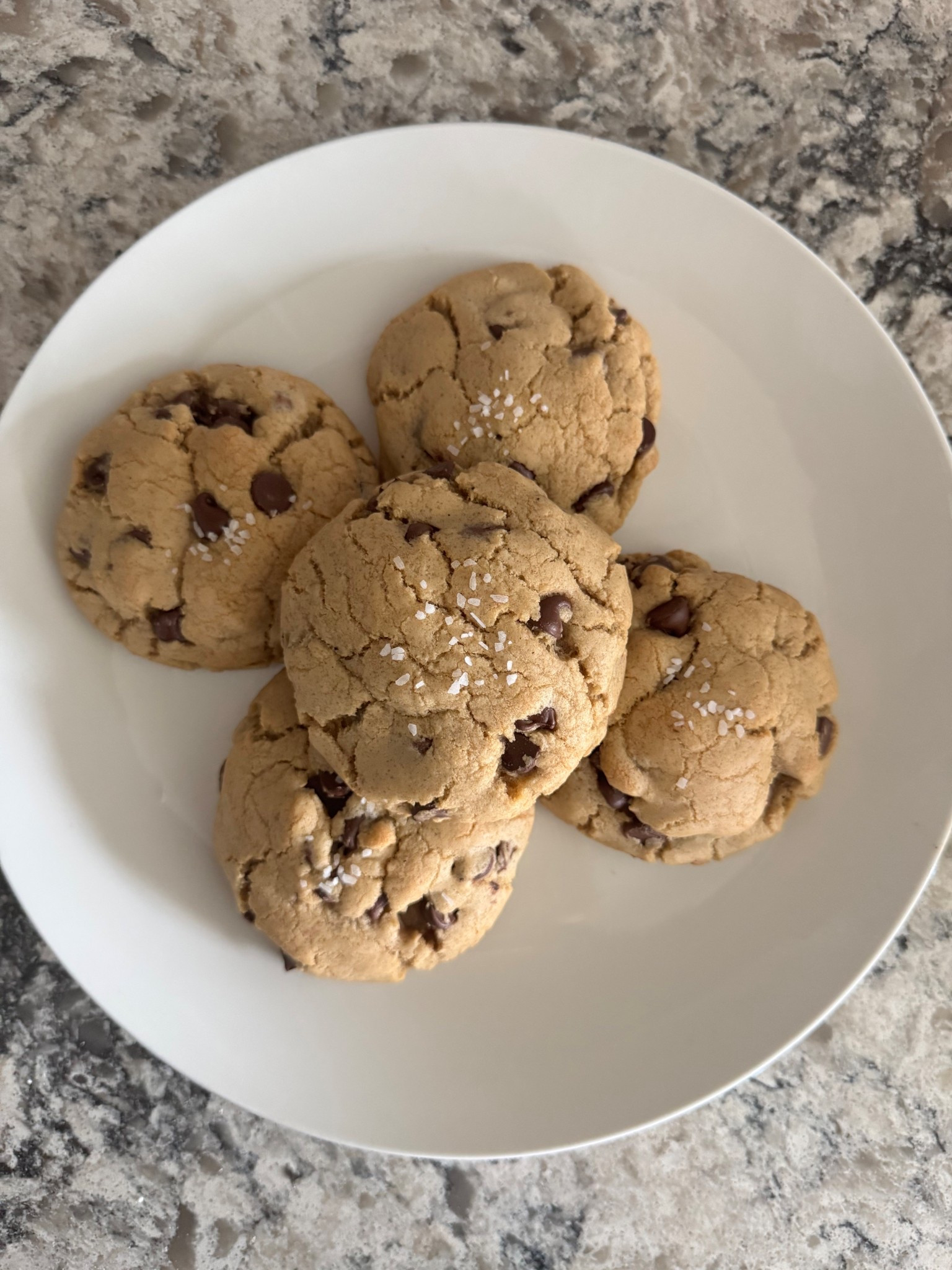 🍪 Brown Butter Chocolate Chip Cookies
Ingredients
* ½ cup (1 stick) unsalted butter
* 1 cup light brown sugar, packed
* ¼ cup granulated sugar
* 1 large egg + 1 egg yolk
* 2 tbsp vanilla extract
* 1¾ cups all-purpose flour
* ¾ tsp salt
* ¾ tsp baking soda
* 1½  chocolate chips (semi-sweet or dark)
* Coarse salt, for sprinkling

Instructions
1. Brown the butter: In a saucepan over medium heat, melt ½ cup butter, stirring often. Continue cooking until it foams, turns golden brown, and smells nutty. Remove from heat and let cool until solidified (refrigerate to speed this up).
2. Cream the butter and sugars: In a mixing bowl, beat the solidified brown butter, light brown sugar, and granulated sugar until light and fluffy.
3. Add wet ingredients: Mix in the egg, egg yolk, and vanilla extract until smooth and glossy.
4. Combine dry ingredients: In a separate bowl, whisk together the flour, salt, and baking soda.
5. Fold together: Gently fold the dry ingredients into the wet mixture until just combined — do not overmix.
6. Add chocolate: Fold in 1½ of chocolate chips.
7. Scoop and chill: Scoop dough into balls (about 2 tbsp each) and place on a baking sheet. Sprinkle with coarse salt and refrigerate for 30 minutes.
8. Bake: Preheat oven to 350°F (175°C). Bake for 14 minutes, until edges are set but centers are still puffy. Do not overbake — they’ll finish setting as they cool.
9. Cool & enjoy: Let cookies cool for a few minutes before transferring to a rack. Enjoy warm with soft centers and caramelized edges.

