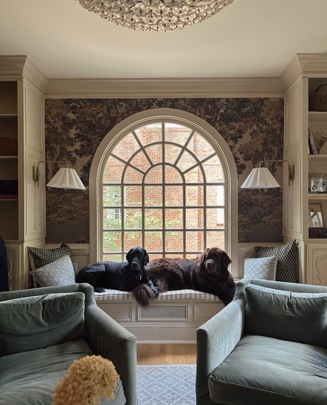 The sconces that make this window seat the coziest part of the house💡📚