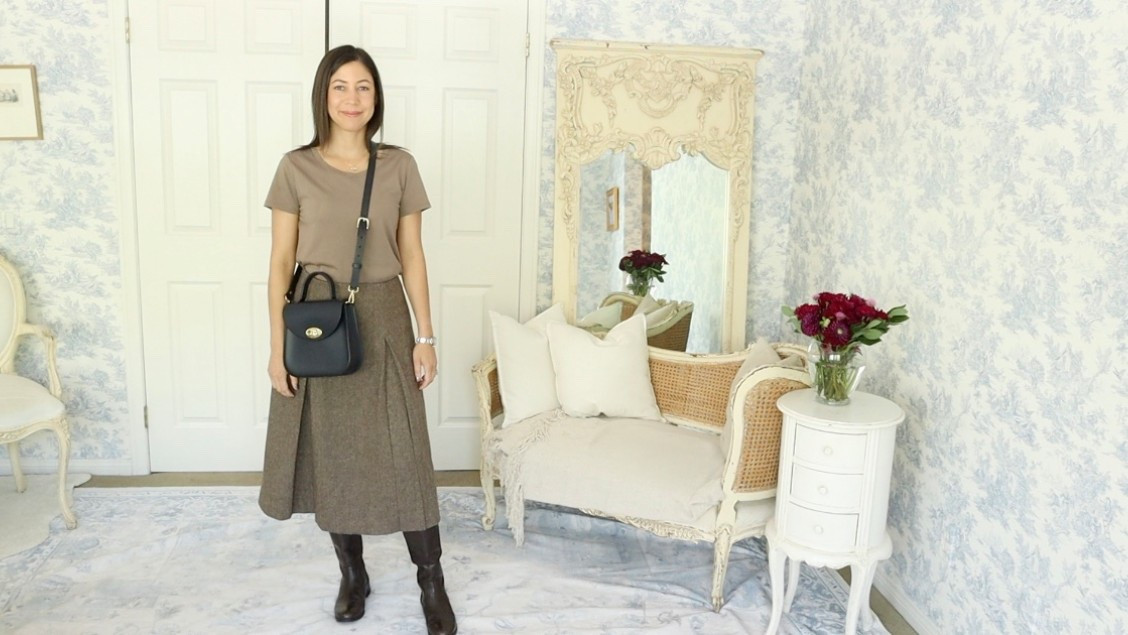 This look is a reminder that effortless can be elegant. I’m wearing the Cotton Modal Scoop Neck Tee (part of the 3-pack bundle from Quince) paired with the timeless Goelia 100% Washable Wool A-Line Skirt and I couldn’t feel more comfortable or put together.

I love the way this soft, neutral tee balances the classic structure of the pleated wool skirt. The combination feels cozy, refined, and very fall-ready. 🍂

To complete the look, I’ve added my Thursday Boots riding boots and my Charlotte Elizabeth crossbody bag perfect for a day of errands or a casual outing that still calls for a little polish.

This outfit is a great example of how a few quality pieces can come together to create a look that’s both practical and chic. That’s the beauty of the ten-item wardrobe versatility, comfort, and style, all wrapped into one thoughtful ensemble.

Do you love pairing basics with classic staples in the fall? I'd love to hear your go-to combo! 🍃

#TenItemWardrobe #OOTD #LTKFallFashion

#LTKSeasonal #LTKHalloween #LTKStyleTip