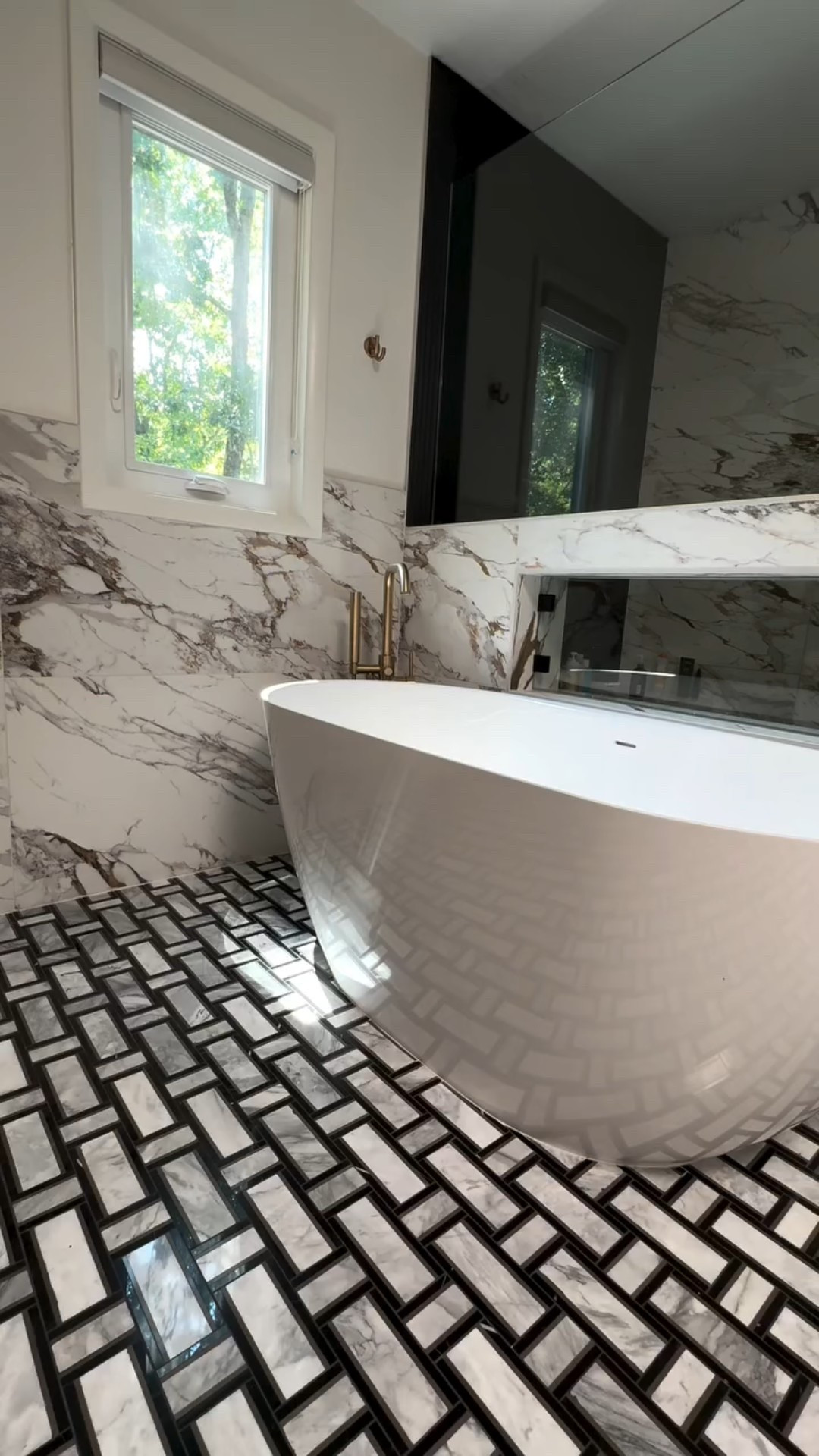 This freestanding tub is the centerpiece, and styling it with a rug and towel makes it feel lived-in. ✨

SBS Designs brings the client’s vision to life, creating a space that’s both beautiful and completely personal. @ltkhome @ltk

#BathroomDesign #FreestandingTub #HomeStyling #InteriorDesign #CozyVibes #LuxuryBathroom #SBSDesigns #BathroomGoals #DesignInspiration #HomeDecor #Ferguson

#LTKHome #LTKFindsUnder100