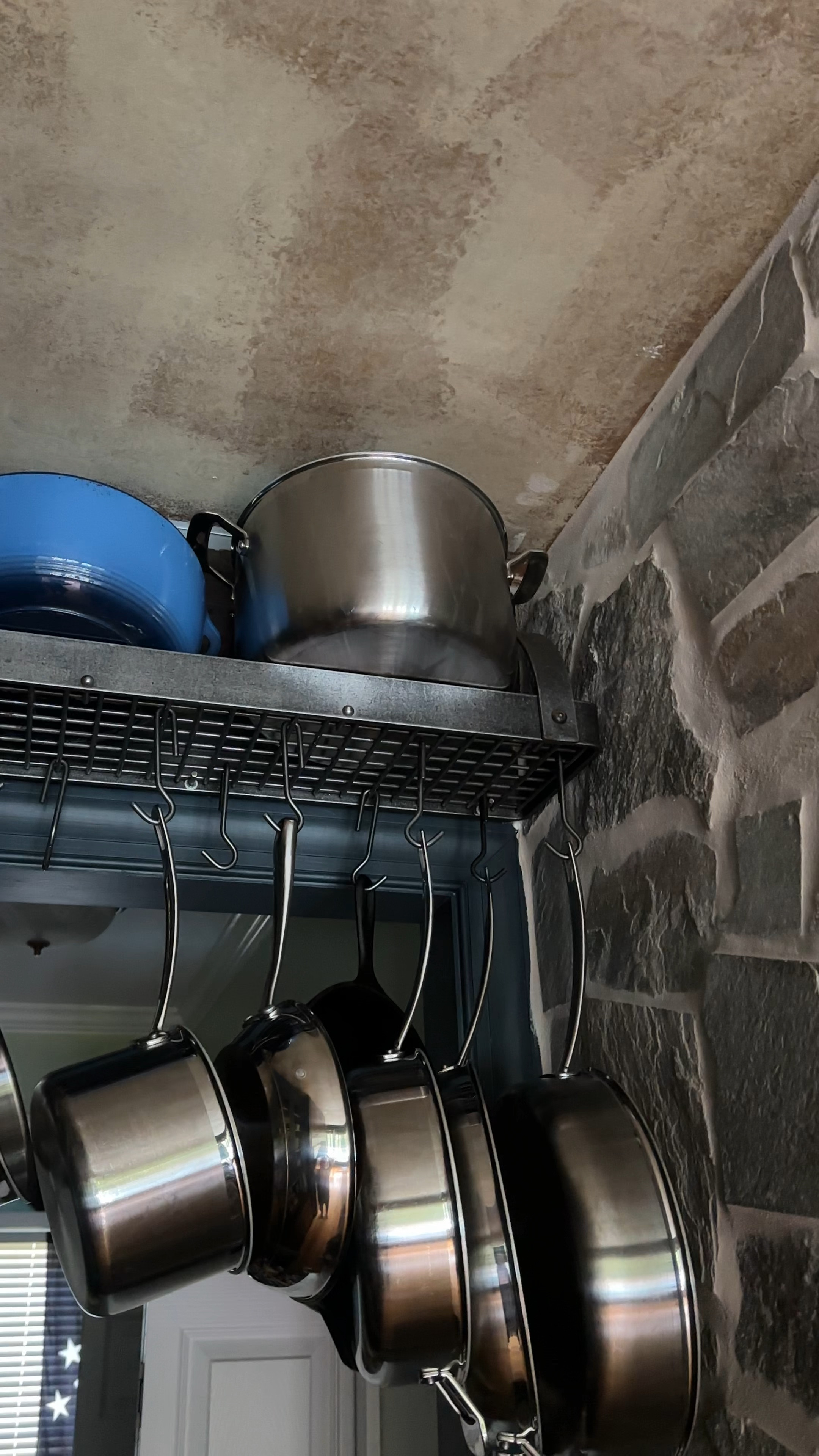 The pot rack saves cabinet space.  And it’s IRON.  And SO COOL.  And in keeping with the less formal antique, European kitchen aesthetic: its function is as important as its charm.  This is hung over the doorway to the pantry in the back corner of the kitchen to hide it from view from the dining room.  Isn’t it 🤩?

#LTKstyletip #LTKVideo #LTKhome
