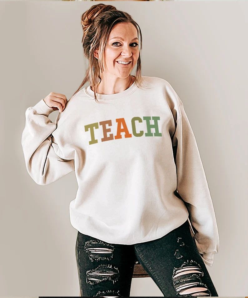 Read the full title
    Teach sweater, teachers gift, holiday teacher top, teacher sweatshirt, te... | Etsy (US)