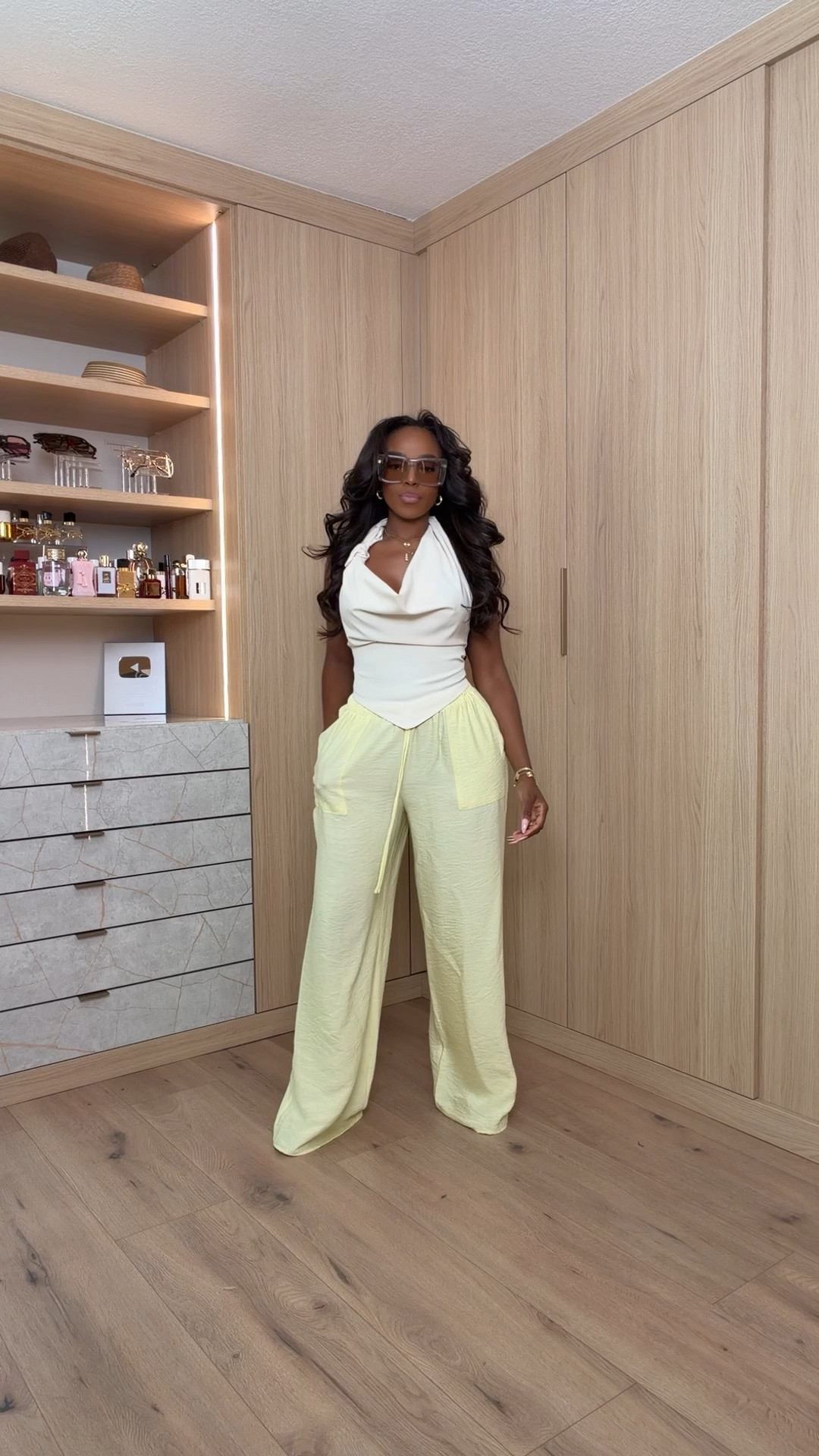 Hi Babes!

Okay this look is giving luxury resort energy. The soft butter yellow trousers paired with this draped ivory top create the prettiest elevated neutral moment, and it looks so effortlessly expensive.

The top drapes beautifully through the neckline while still creating shape through the waist, and these flowy pants are incredibly flattering. I love how the soft yellow adds just enough color while still keeping the entire look chic and sophisticated.

Where to wear this:
• Resort vacations
• Brunch with the girls
• Vacation dinners
• Summer events
• Rooftop lunches

Accessories:
The oversized sunglasses instantly elevate this look and give it that rich-girl vacation vibe. Add simple gold jewelry and a neutral sandal or heel to complete the outfit.

Everything is linked below

xx Kira | IG: KirasFashionFinds

34D - 27 - 40 • Size Small or 4