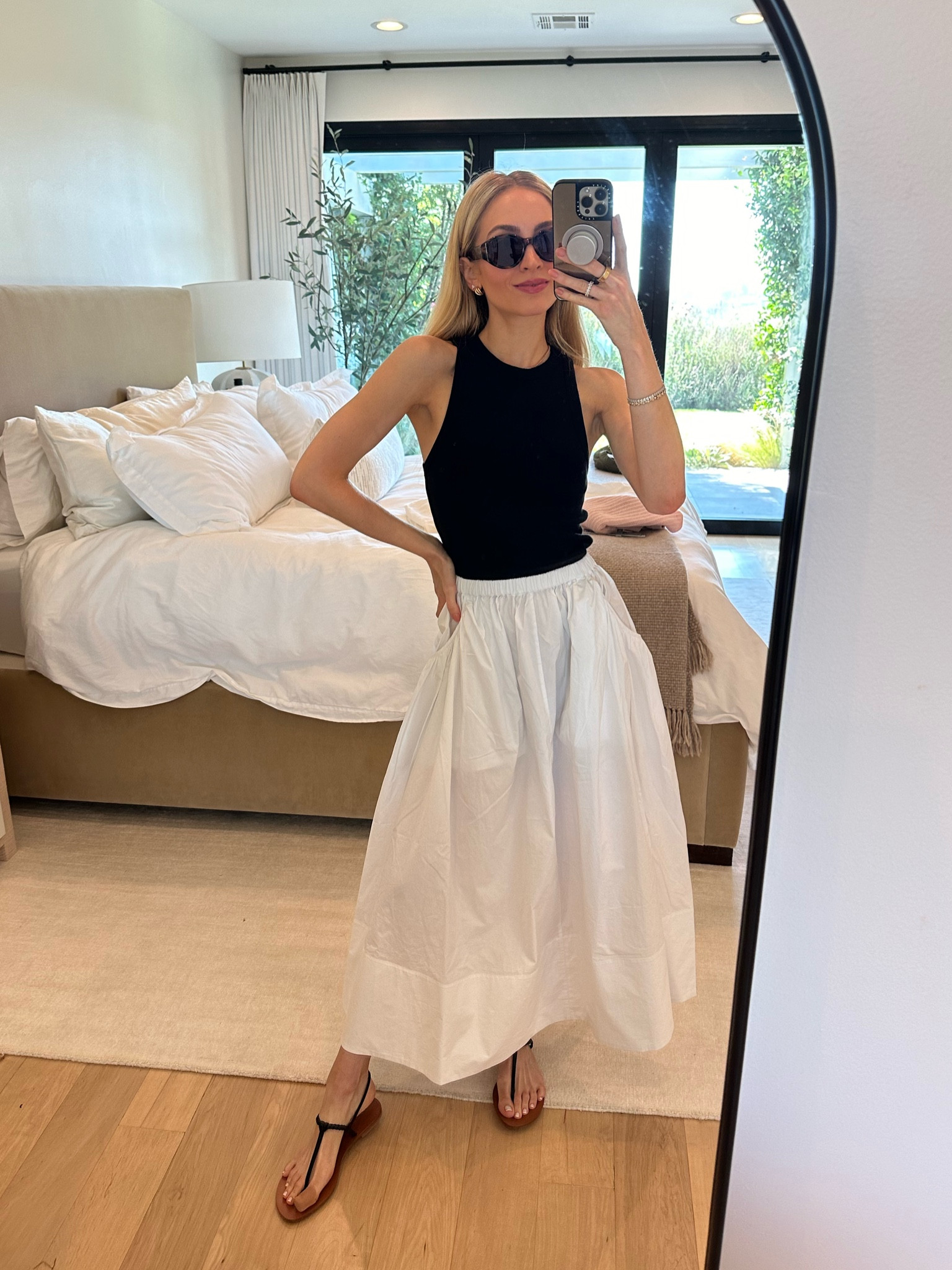 Breezy look today 🤍 this black tank is a nice weight and very high quality. The poplin skirt is so light and breathable - good for this end of summer LA heat 🥵

Sizes worn here:
Tank - XS (TTS)
Skirt - XXS (TTS, stretchy)

#LTKSeasonal #LTKStyleTip