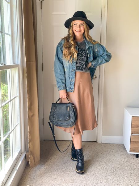 Cute casual fall outfit idea!! I’ve linked lots of similar items such as this camel silk skirt, oversized denim jacket, Halloween graphic t-shirt, saddle bag, black boots, and wide brim fedora hat! Date night outfit idea! 

#LTKitbag #LTKstyletip #LTKunder100